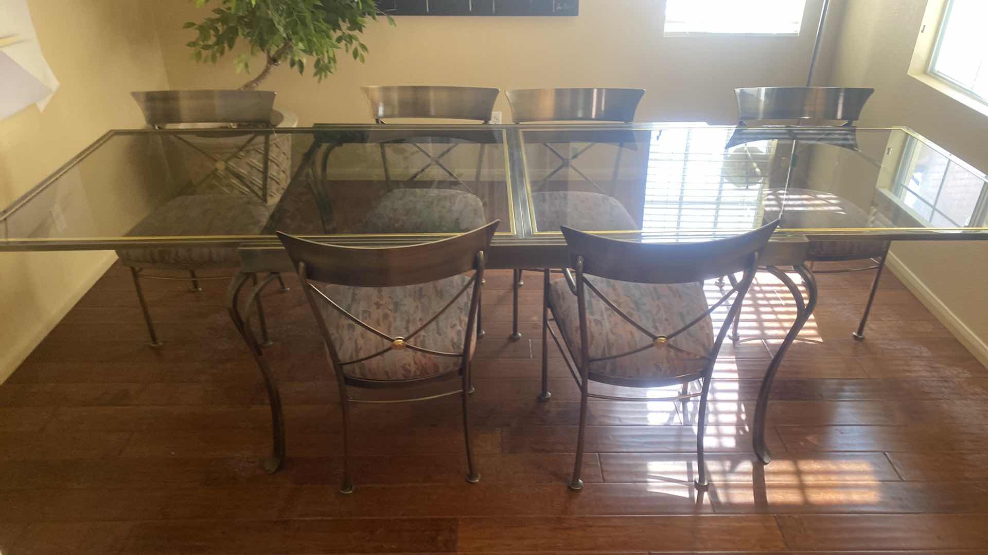 Photo 1 of 7 PIECE SMOKED GLASS AND HEAVY METAL TABLE, WITH 6 CHAIRS (2 ARM CHAIRS 4 DINING CHAIRS, TABLE EXPANDS) 5’ X 40” H30” EXPANDS TO 10’