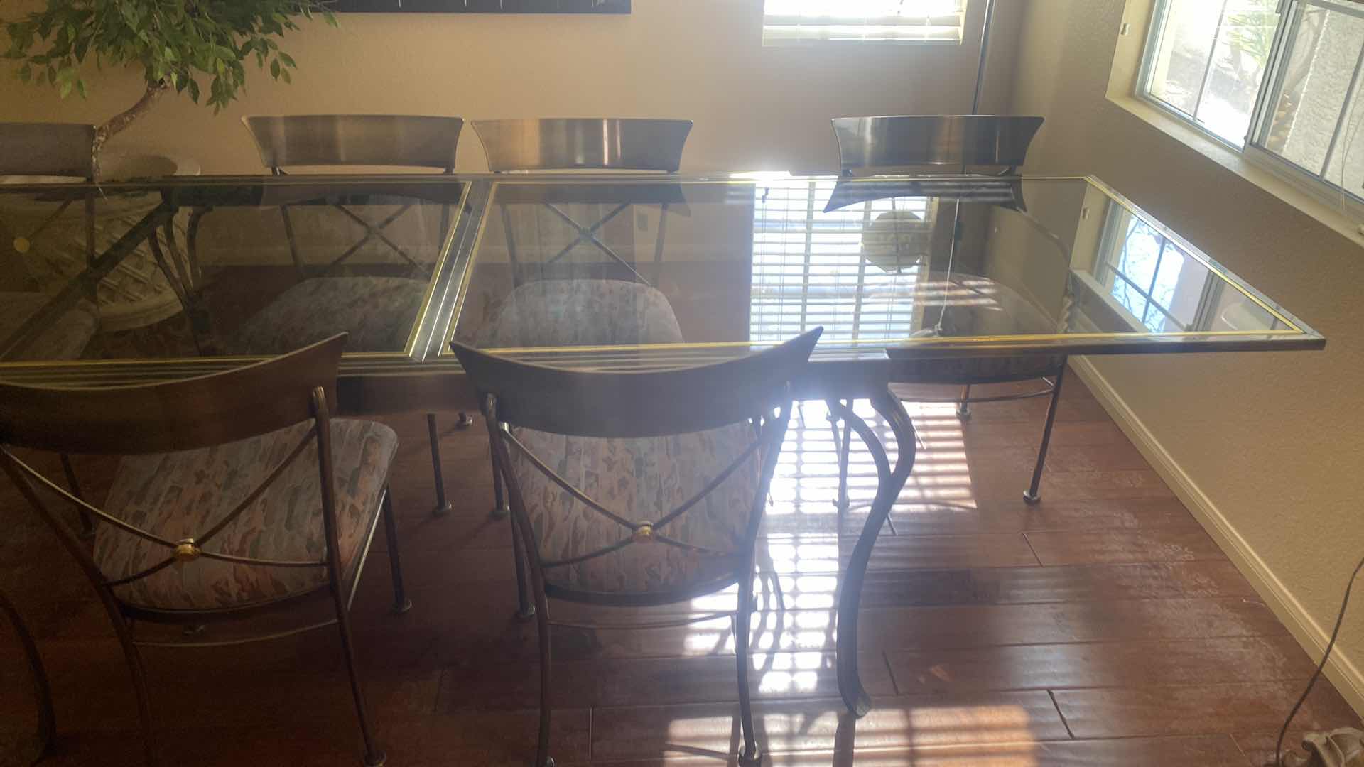 Photo 1 of 7 PIECE SMOKED GLASS AND HEAVY METAL TABLE, WITH 6 CHAIRS (2 ARM CHAIRS 4 DINING CHAIRS, TABLE EXPANDS) 5’ X 40” H30” EXPANDS TO 10’