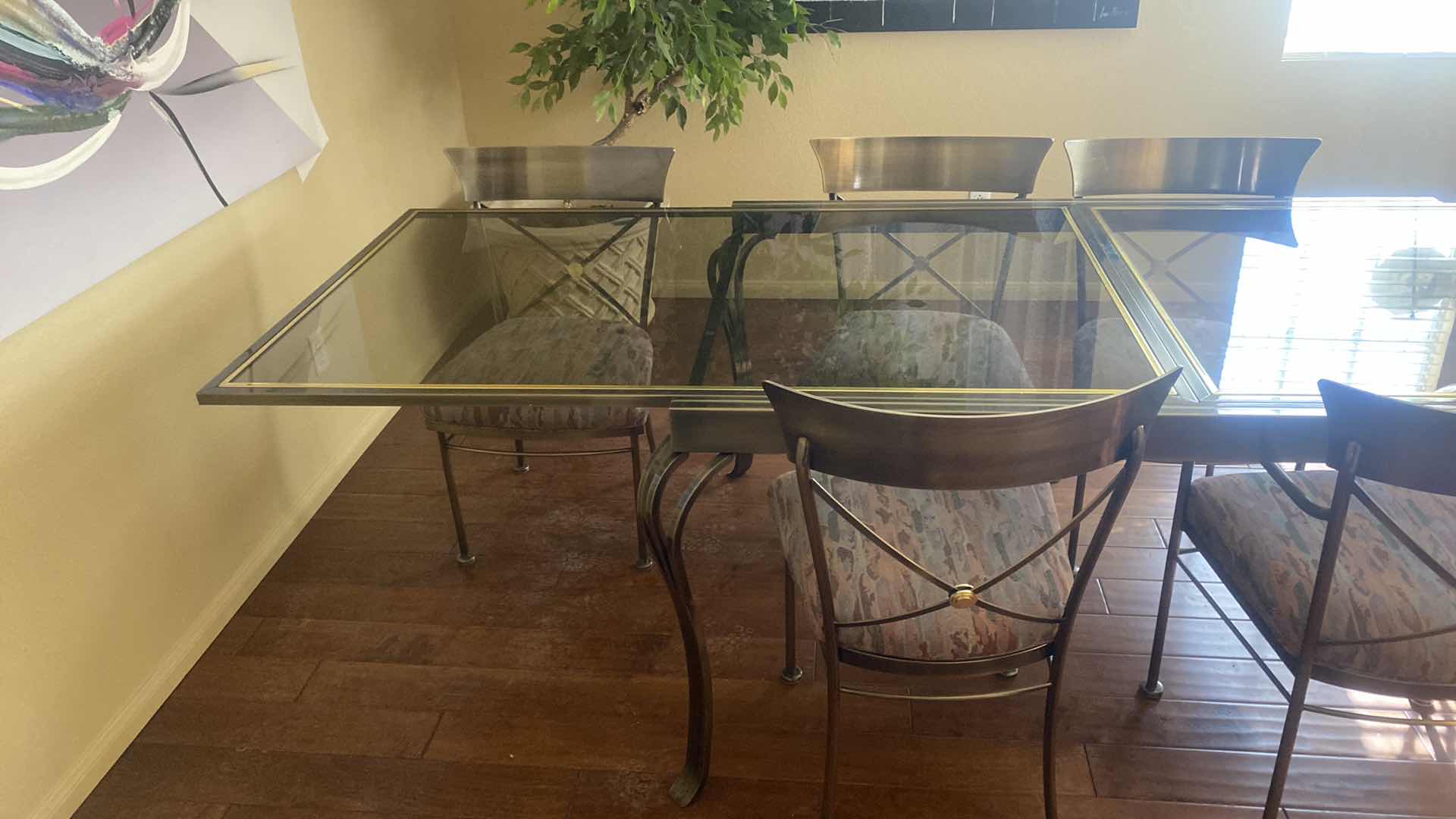 Photo 1 of 7 PIECE SMOKED GLASS AND HEAVY METAL TABLE, WITH 6 CHAIRS (2 ARM CHAIRS 4 DINING CHAIRS, TABLE EXPANDS) 5’ X 40” H30” EXPANDS TO 10’