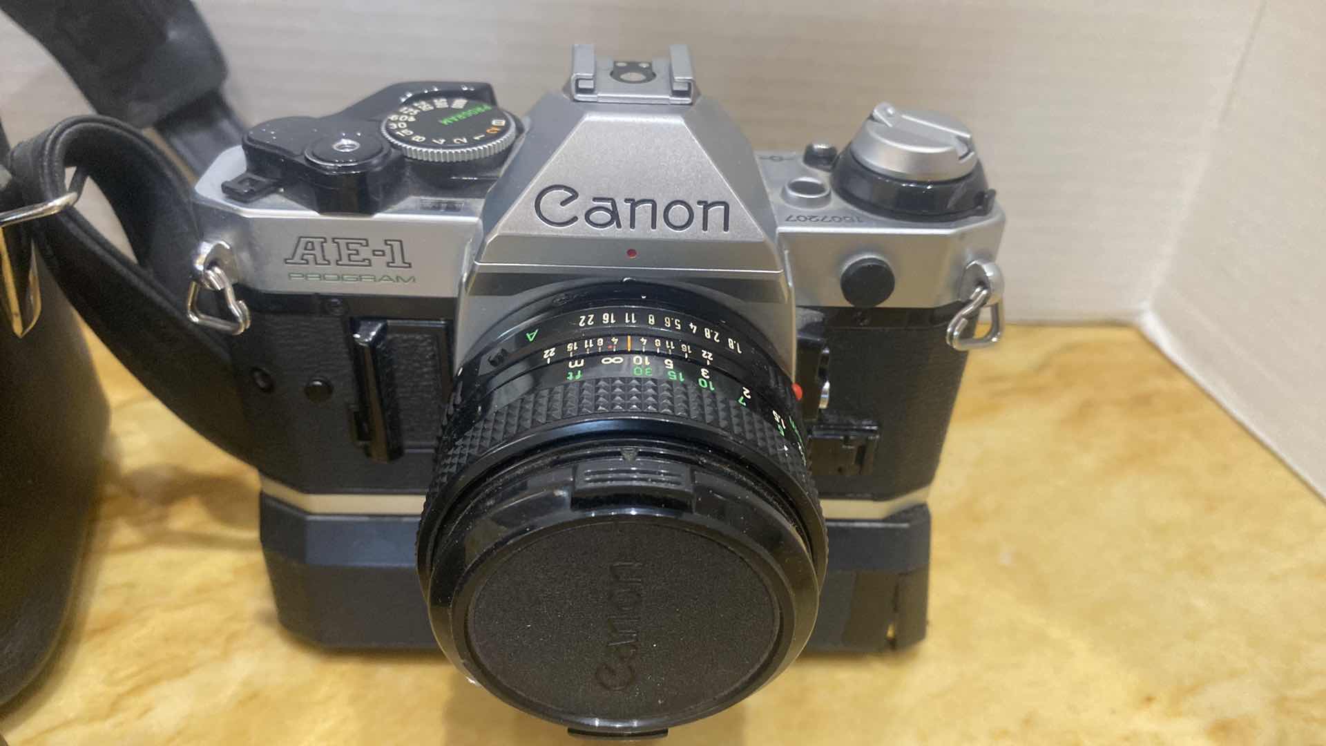 Photo 1 of VINTAGE CANON AE ONE PROGRAM 35 MM CAMERA WITH FLASH AND BAG