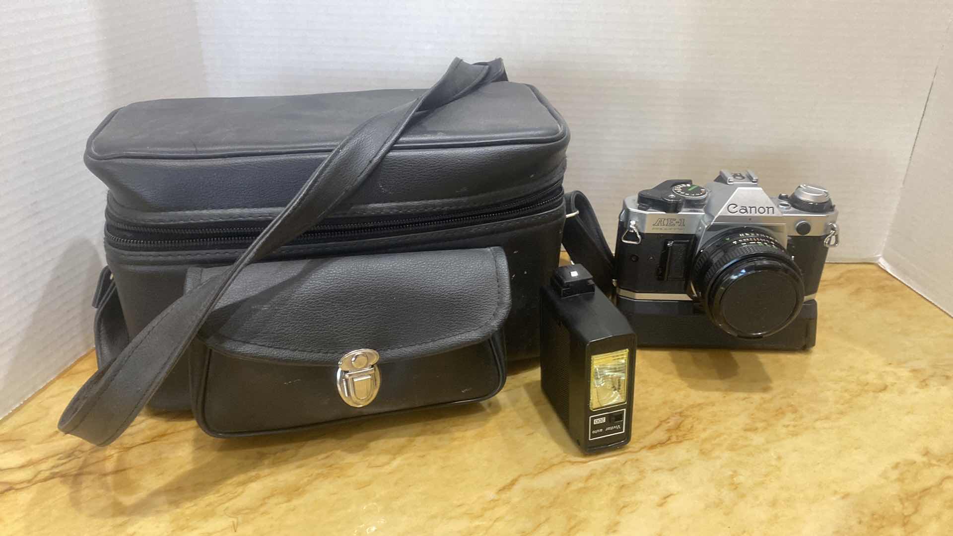 Photo 1 of VINTAGE CANON AE ONE PROGRAM 35 MM CAMERA WITH FLASH AND BAG