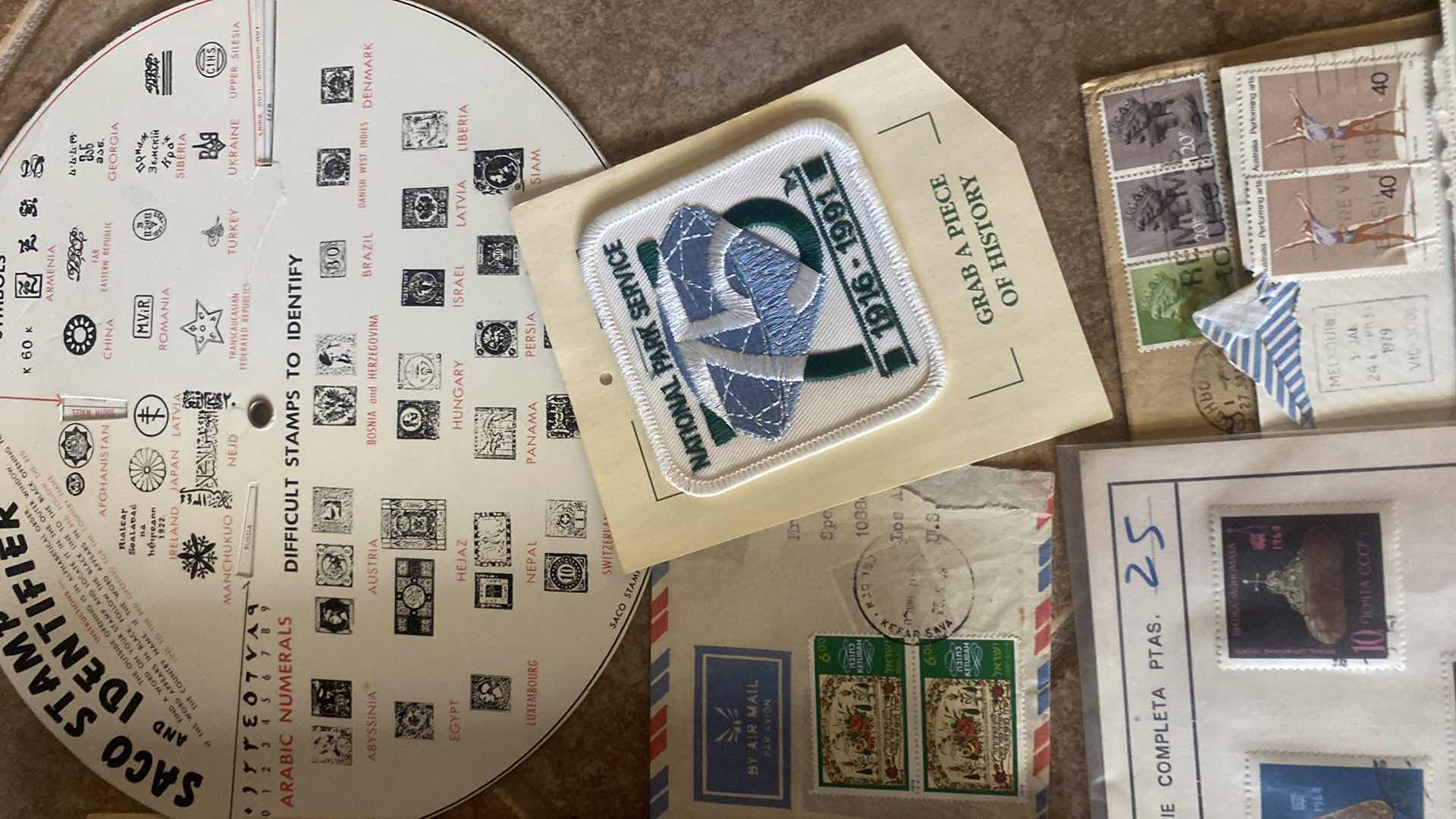 Photo 1 of THE COMPREHENSIVE WORLDWIDE STAMP ALBUM WITH ASSORTMENT OF STAMPS