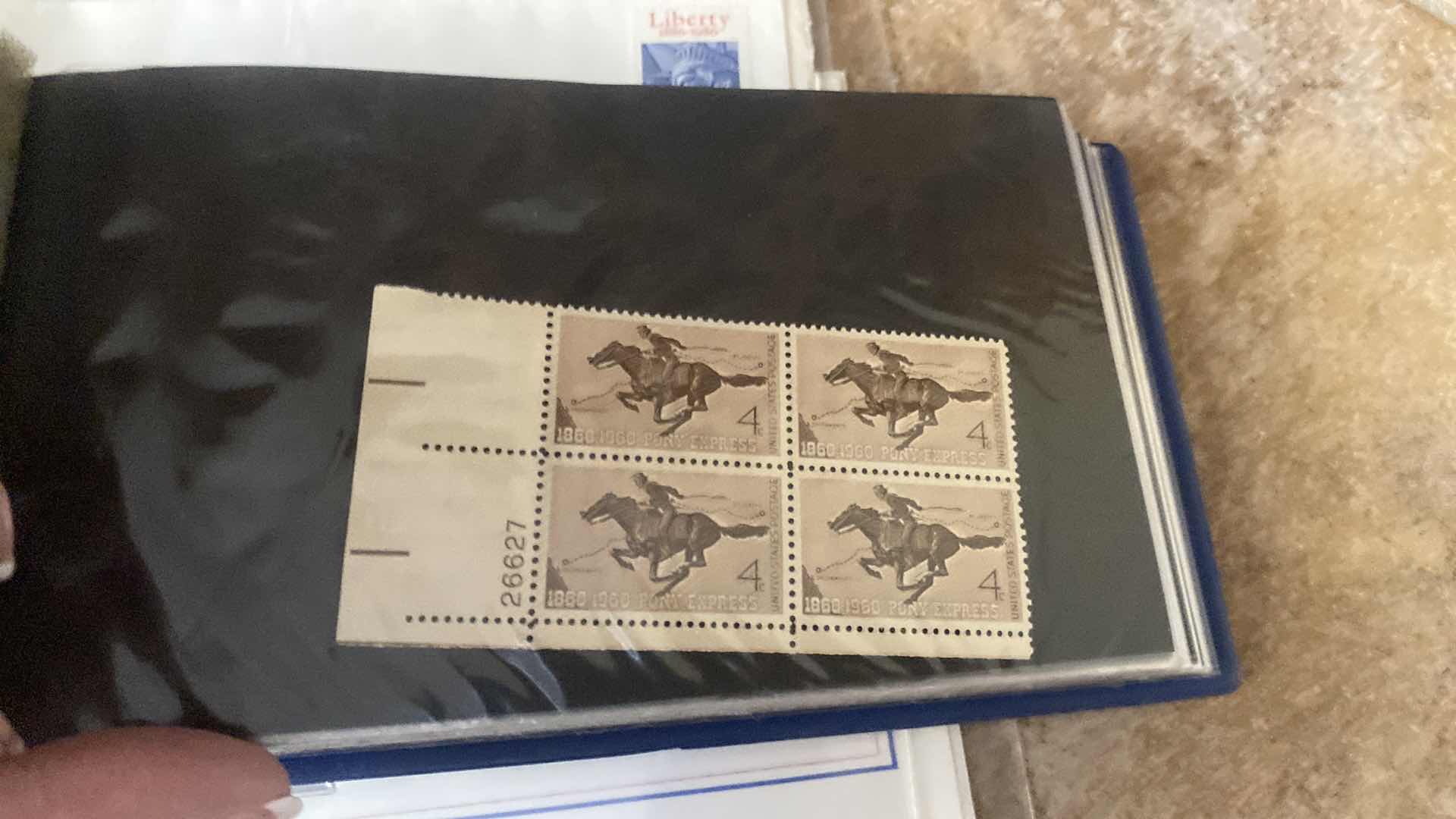 Photo 1 of STAMP COLLECTION ALBUM AND TWO OFFICIAL CENTENNIAL SEAL STATUE OF LIBERTY RESTORATION