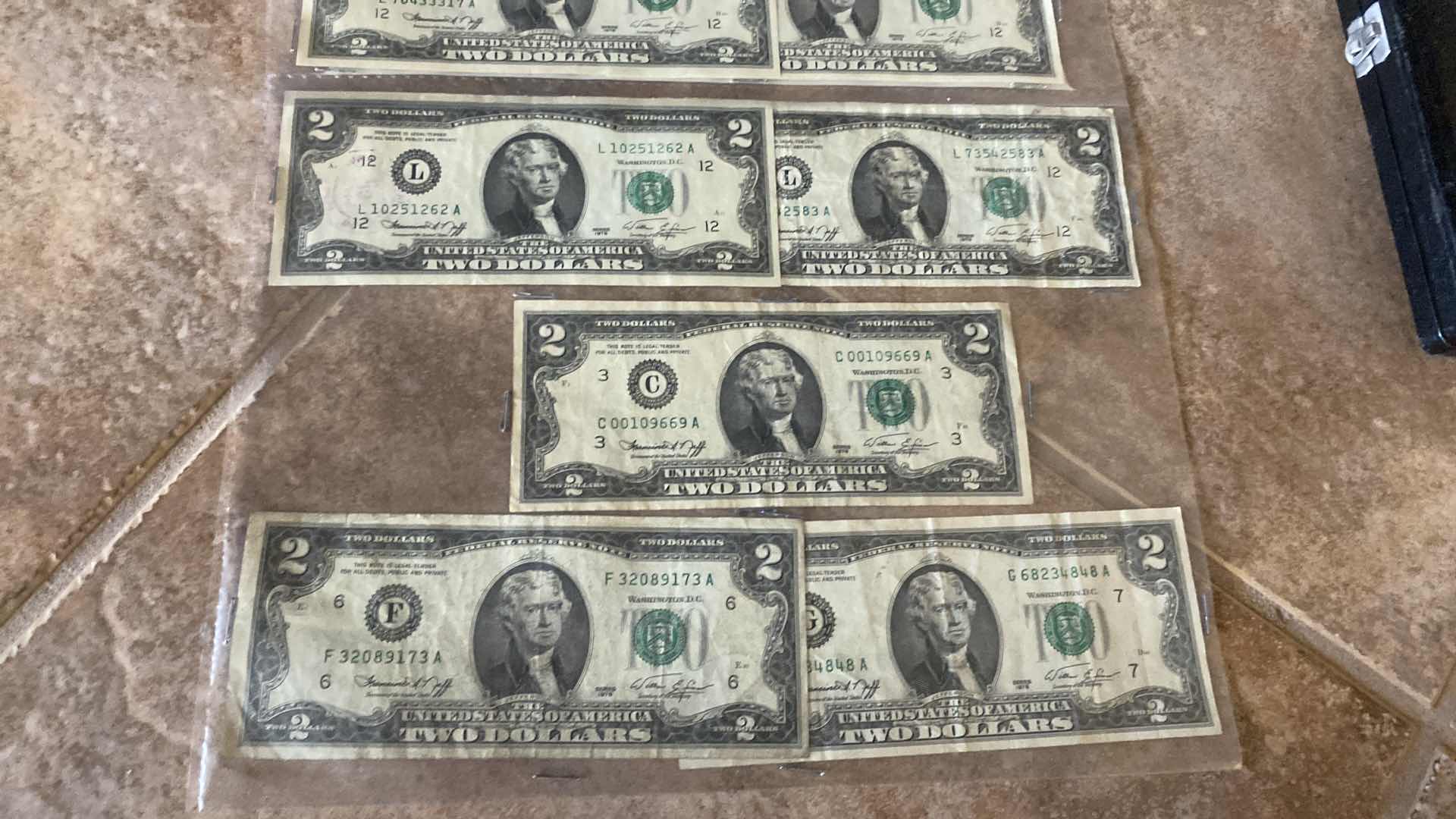 Photo 1 of 17-VINTAGE 1976 CIRCULATED $2 DOLLAR BILLS
