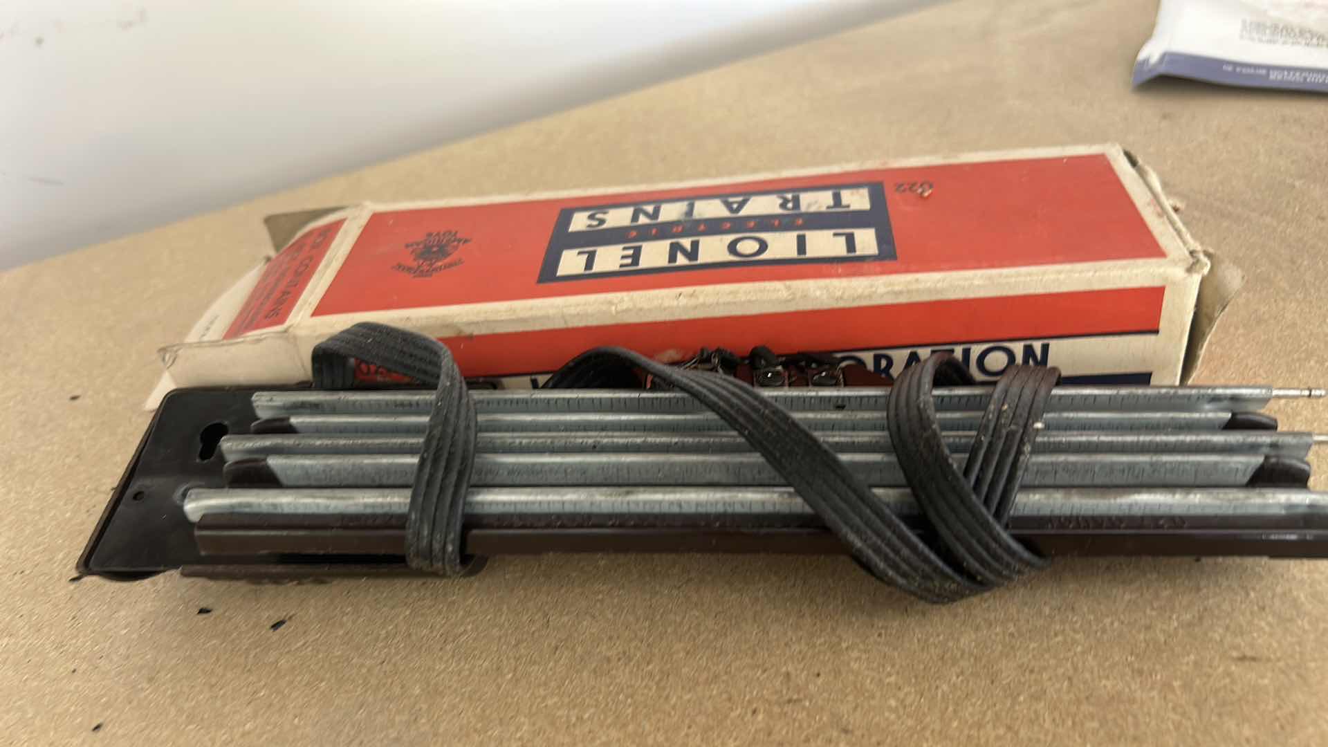Photo 1 of LIONEL TRAIN TRACKS & MORE - 32 STRAIGHT, 22 CURVED, CONTROL SWITCHES, LAYOUT GUIDE, VINTAGE MODEL RAILROAD MAGAZINE & MANUALS WITH VINTAGE TRUNK