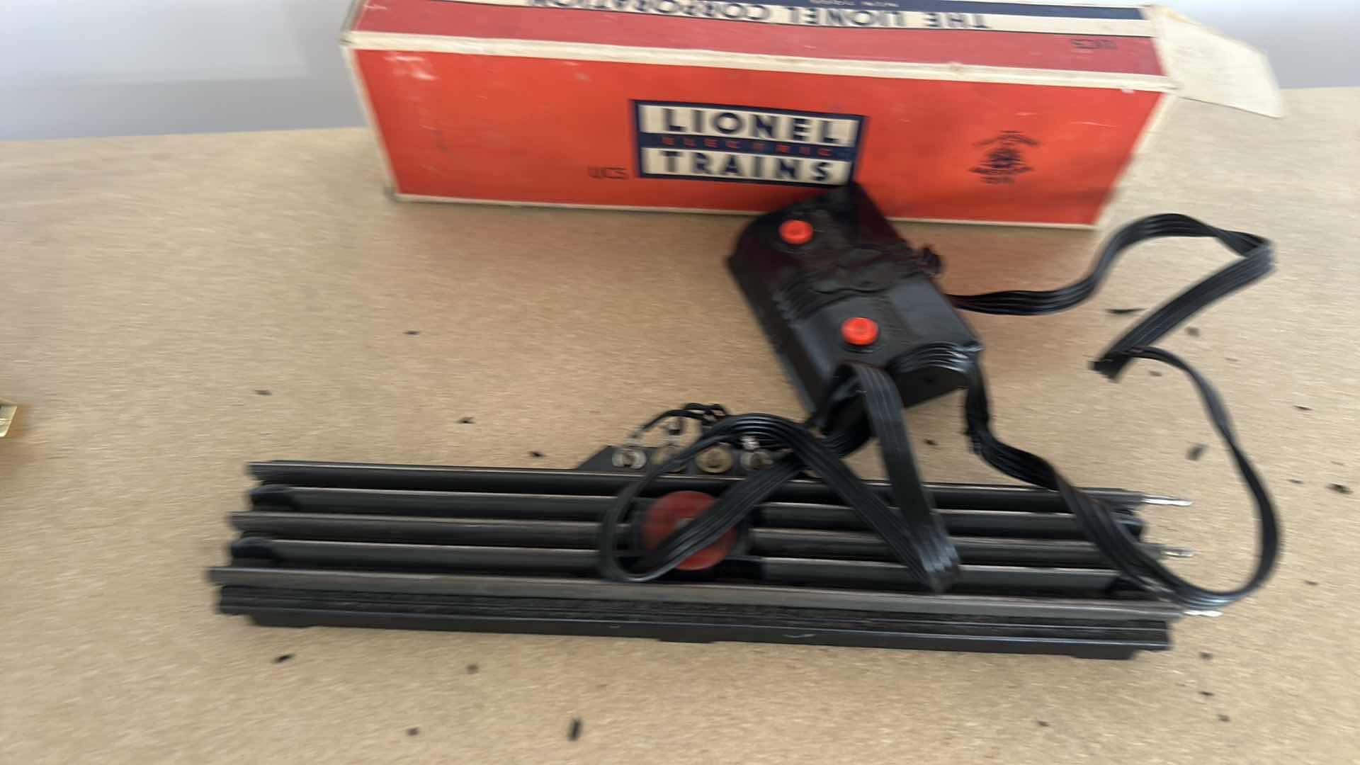 Photo 1 of LIONEL TRAIN TRACKS & MORE - 32 STRAIGHT, 22 CURVED, CONTROL SWITCHES, LAYOUT GUIDE, VINTAGE MODEL RAILROAD MAGAZINE & MANUALS WITH VINTAGE TRUNK
