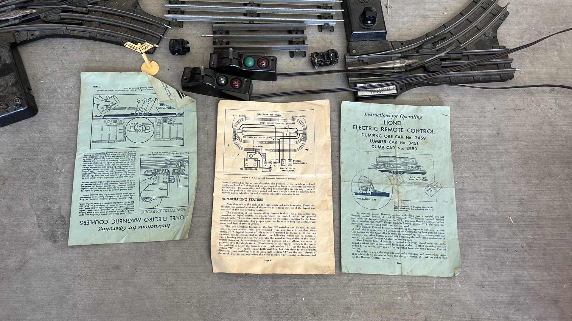 Photo 1 of LIONEL TRAIN TRACKS & MORE - 32 STRAIGHT, 22 CURVED, CONTROL SWITCHES, LAYOUT GUIDE, VINTAGE MODEL RAILROAD MAGAZINE & MANUALS WITH VINTAGE TRUNK