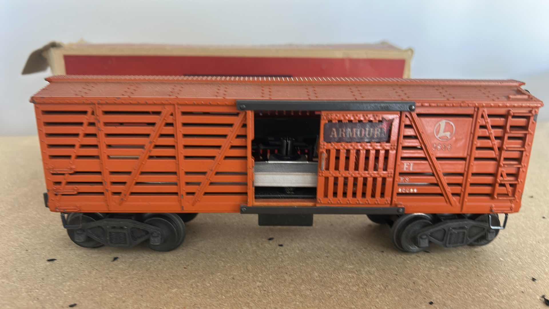 Photo 1 of VINTAGE LIONEL NO. 3656 OPERATING CATTLE CAR, ORIGINALLY MANUFACTURED IN THE POSTWAR ERA AROUND THE MID-1950S. WITH BOX OF COWS