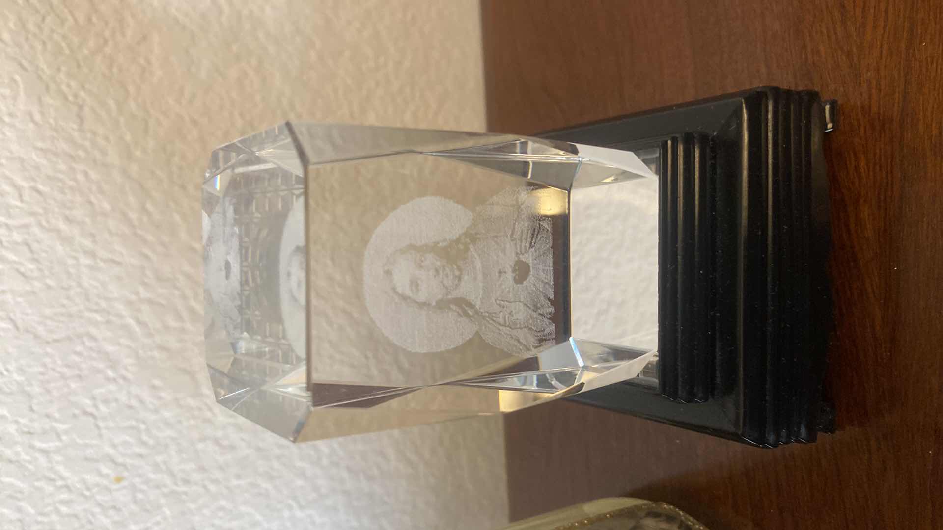 Photo 1 of PAIR OF 3-D LASER ENGRAVED GLASS BLOCKS ON STEPPED UP DISPLAY BASE H 5 1/4” WITH RELIGIOUS VASE H 8“