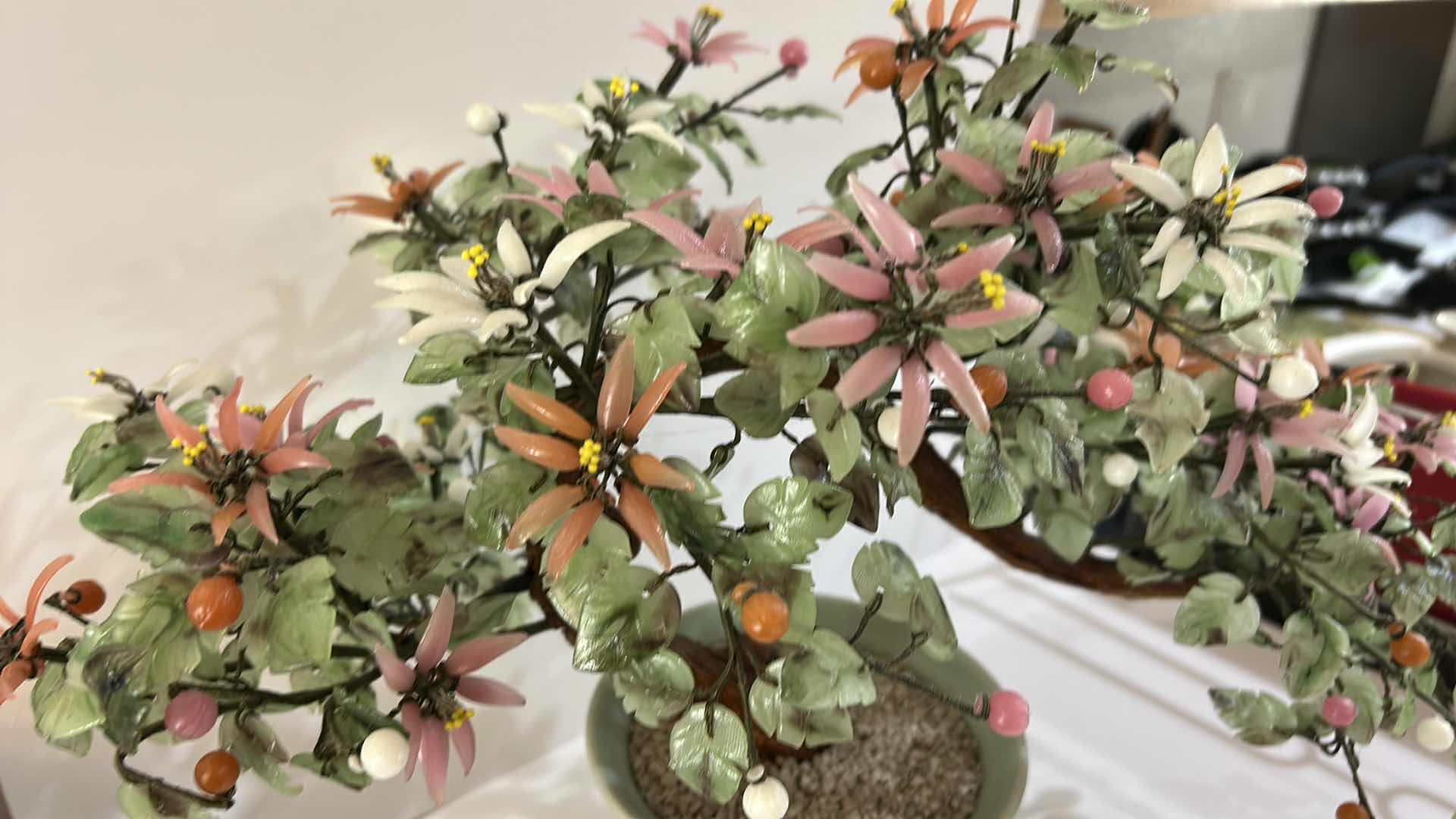 Photo 1 of VINTAGE HANDCRAFTED GEMSTONE BONSAI TREE WITH COLORFUL FLORAL ACCENTS DECORATIVE CELADON-STYLE CERAMIC POT H15”
ESTIMATED RETAIL VALUE: $125 H15”