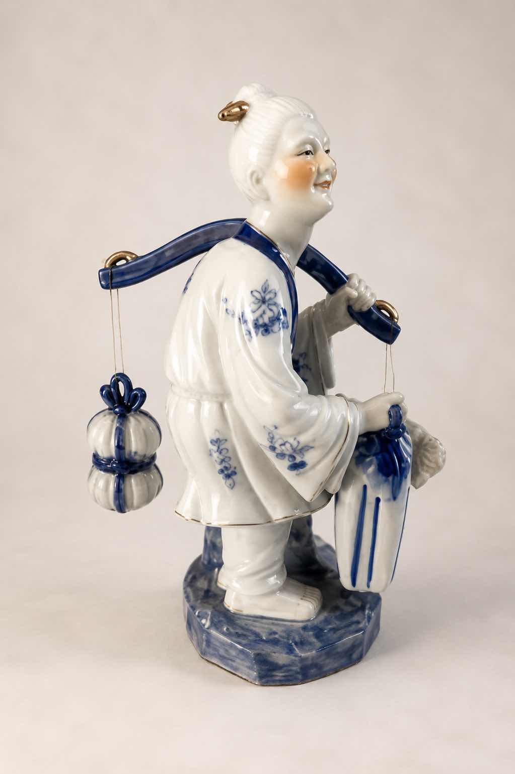 Photo 1 of VINTAGE BLUE & WHITE ASIAN PORCELAIN FISHERMAN FIGURINE DETAILED HAND-PAINTED FIGURE WITH FISH & HANGING VESSEL
ESTIMATED RETAIL VALUE: $125 H15”