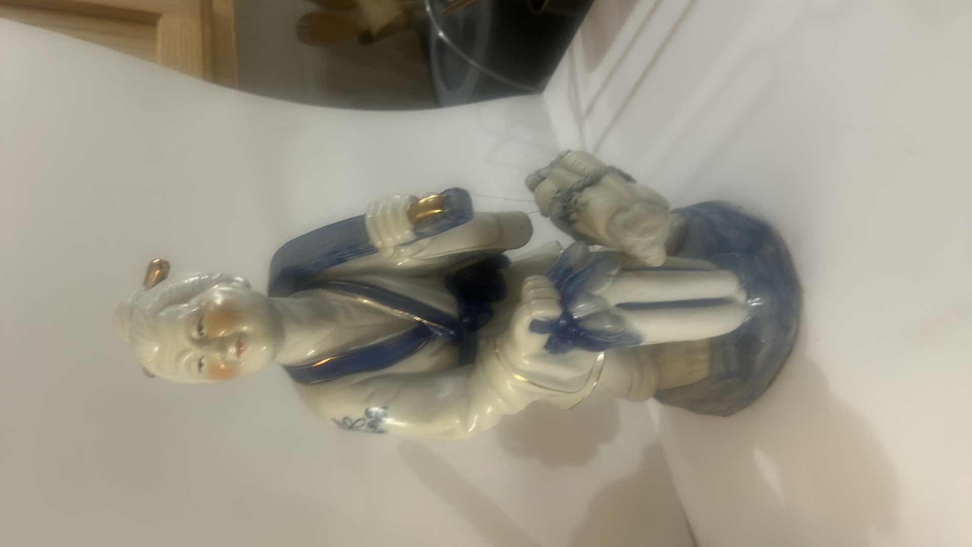 Photo 1 of VINTAGE BLUE & WHITE ASIAN PORCELAIN FISHERMAN FIGURINE DETAILED HAND-PAINTED FIGURE WITH FISH & HANGING VESSEL
ESTIMATED RETAIL VALUE: $125 H15”