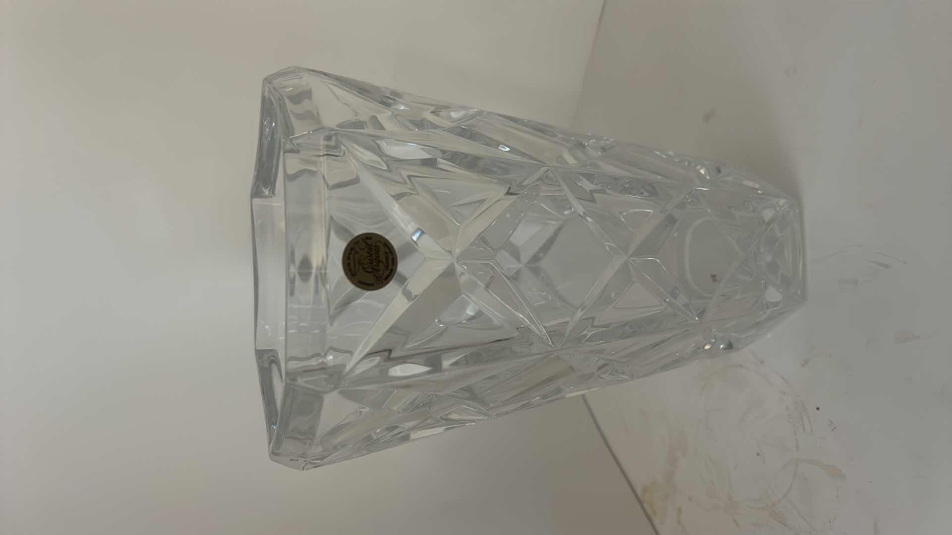 View 2 of CRISTAL ARQUES FRANCE - HAND CUT LEAD CRYSTAL VASE WITH GEOMETRIC FACETED DESIGN AND ORIGINAL LABEL.
ESTIMATED RETAIL VALUE: $75–$125 H9.5”