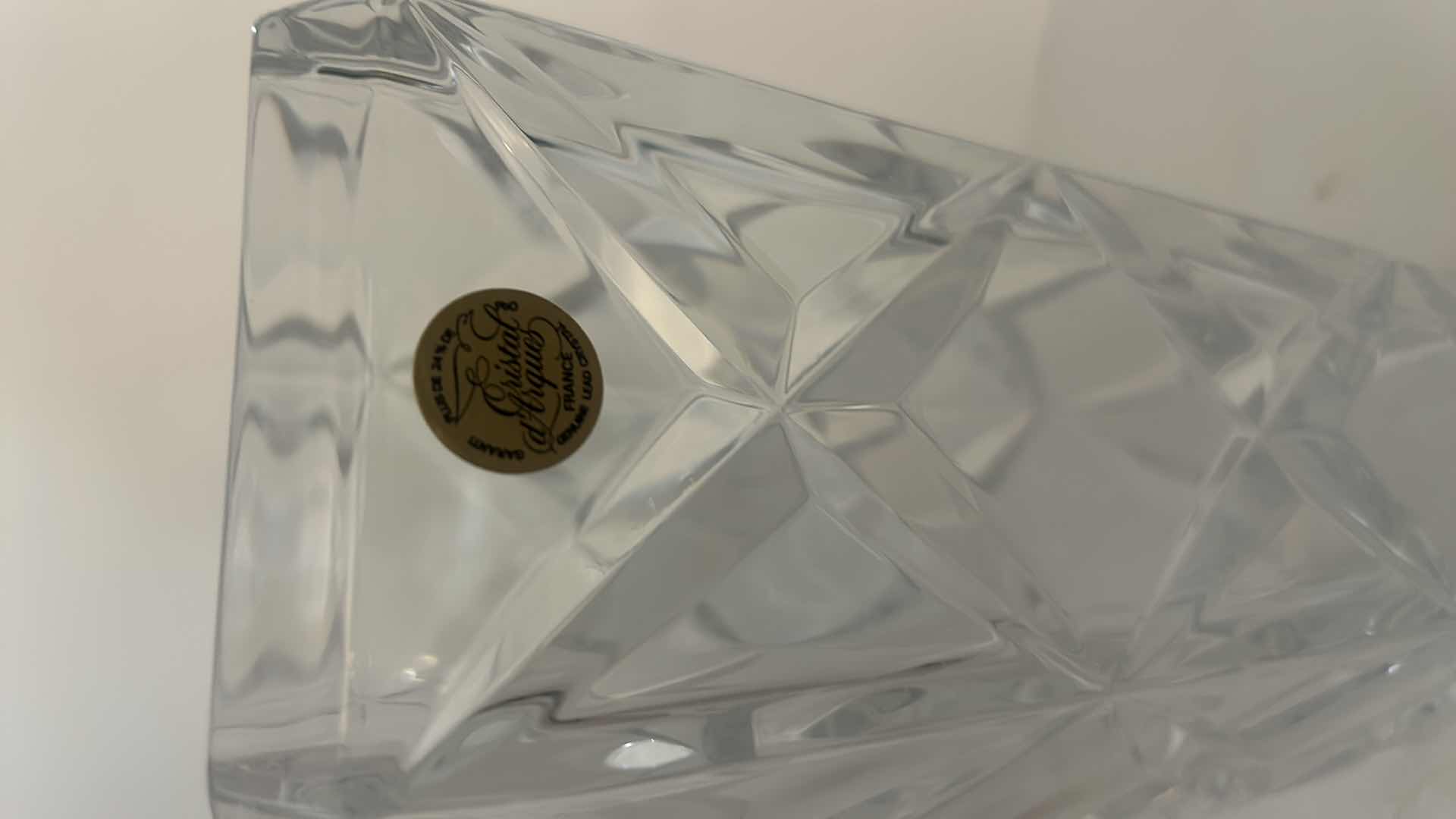 View 3 of CRISTAL ARQUES FRANCE - HAND CUT LEAD CRYSTAL VASE WITH GEOMETRIC FACETED DESIGN AND ORIGINAL LABEL.
ESTIMATED RETAIL VALUE: $75–$125 H9.5”