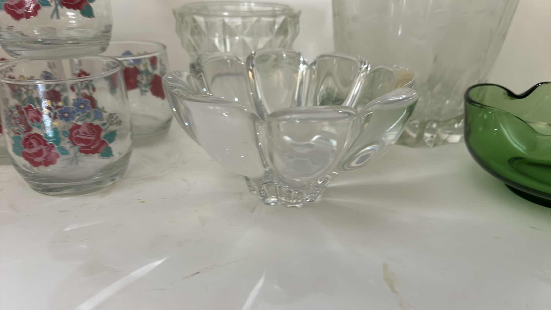 Photo 1 of ASSORTED VINTAGE GLASSWARE INCLUDING 4 FLORAL TUMBLERS, CLEAR PRESSED GLASS BOWLS AND GREEN ART GLASS DISH.