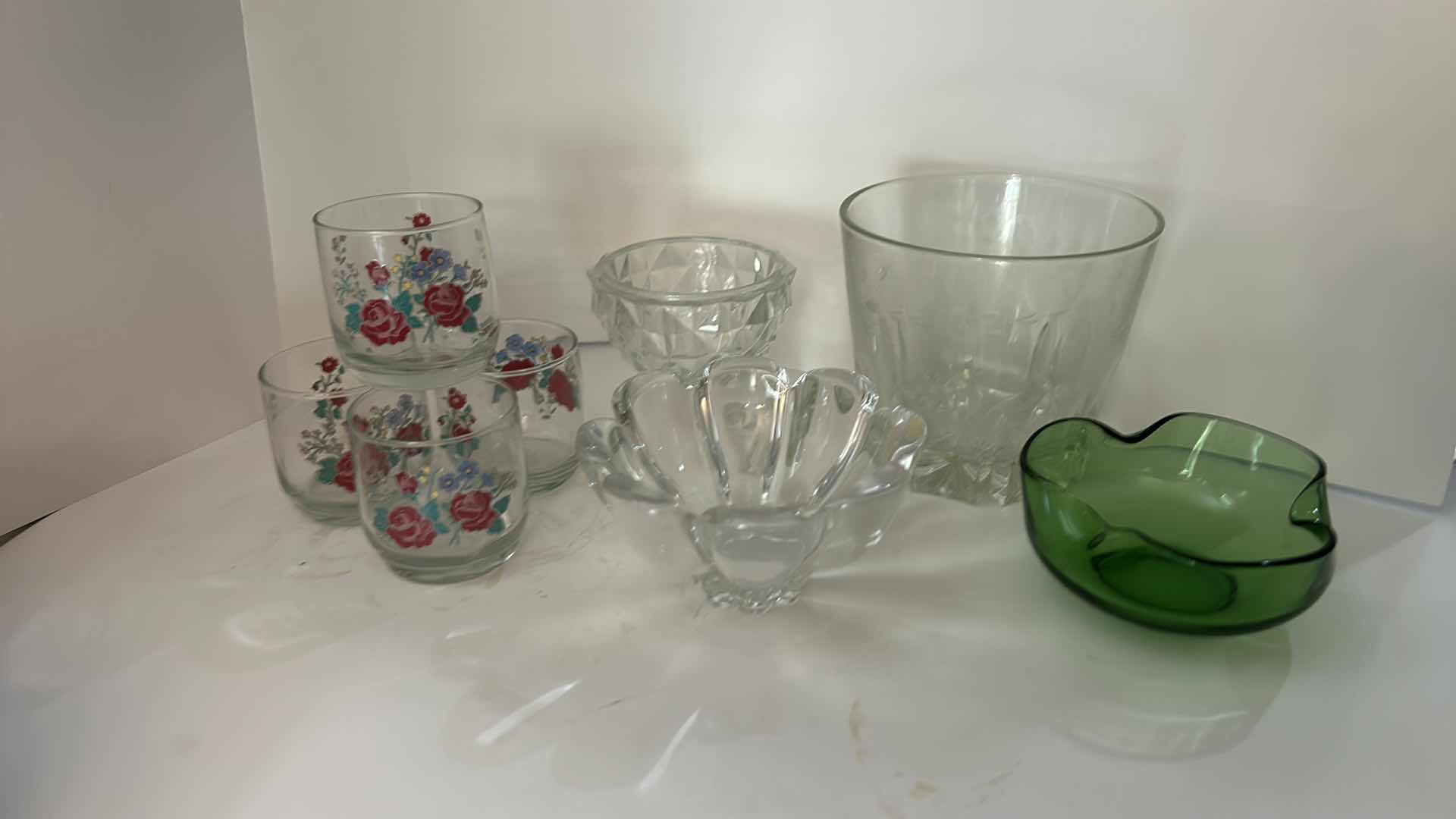 Photo 1 of ASSORTED VINTAGE GLASSWARE INCLUDING 4 FLORAL TUMBLERS, CLEAR PRESSED GLASS BOWLS AND GREEN ART GLASS DISH.
