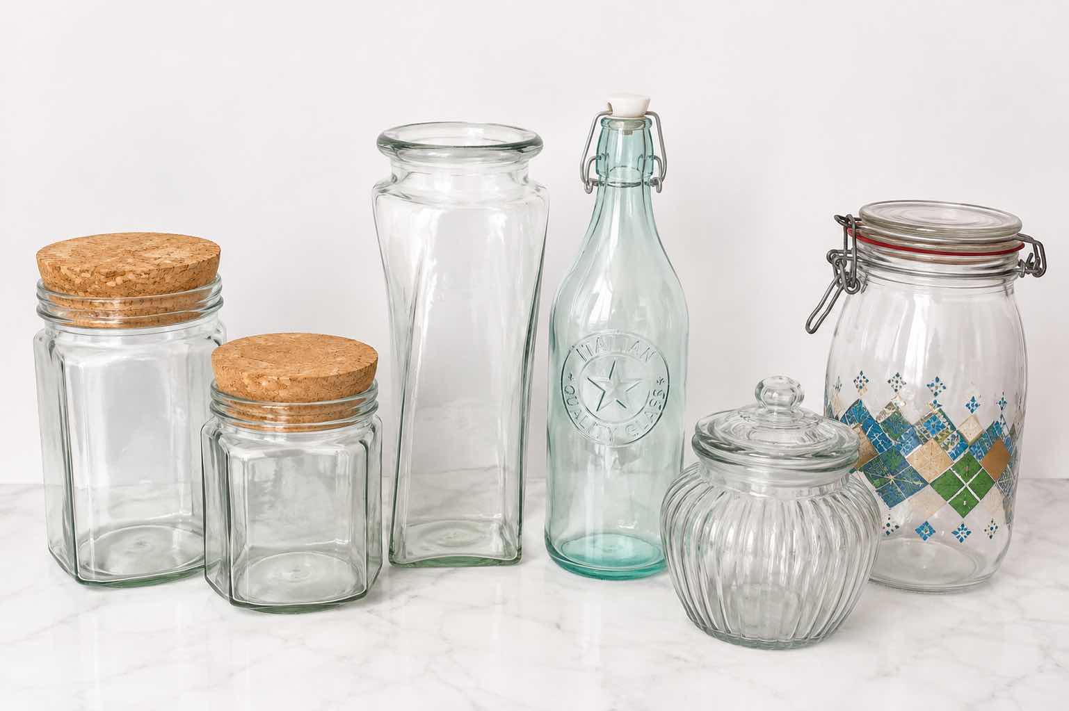 Photo 1 of ASSORTED CLEAR GLASS KITCHEN STORAGE JARS, CANISTERS & BOTTLE WITH CORK, GLASS AND CLAMP-TOP LIDS