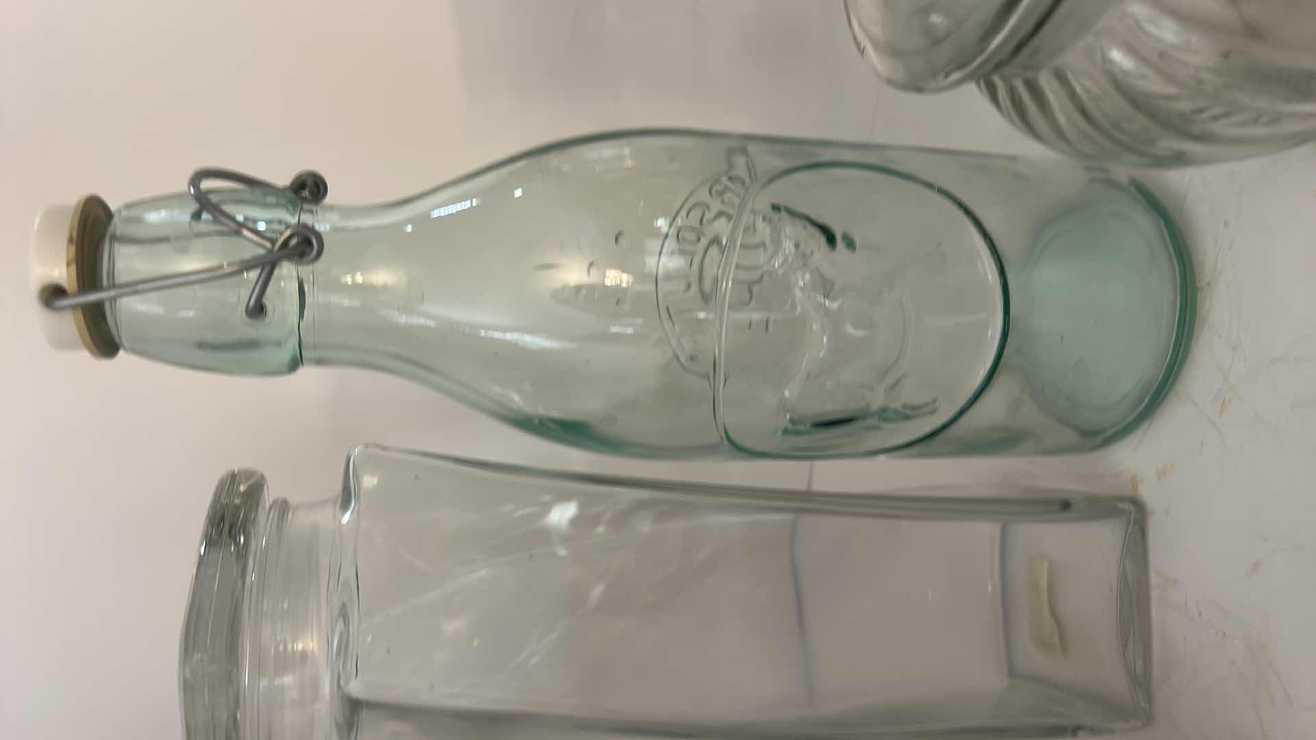 Photo 1 of ASSORTED CLEAR GLASS KITCHEN STORAGE JARS, CANISTERS & BOTTLE WITH CORK, GLASS AND CLAMP-TOP LIDS