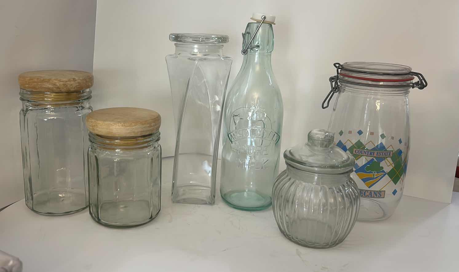 Photo 1 of ASSORTED CLEAR GLASS KITCHEN STORAGE JARS, CANISTERS & BOTTLE WITH CORK, GLASS AND CLAMP-TOP LIDS