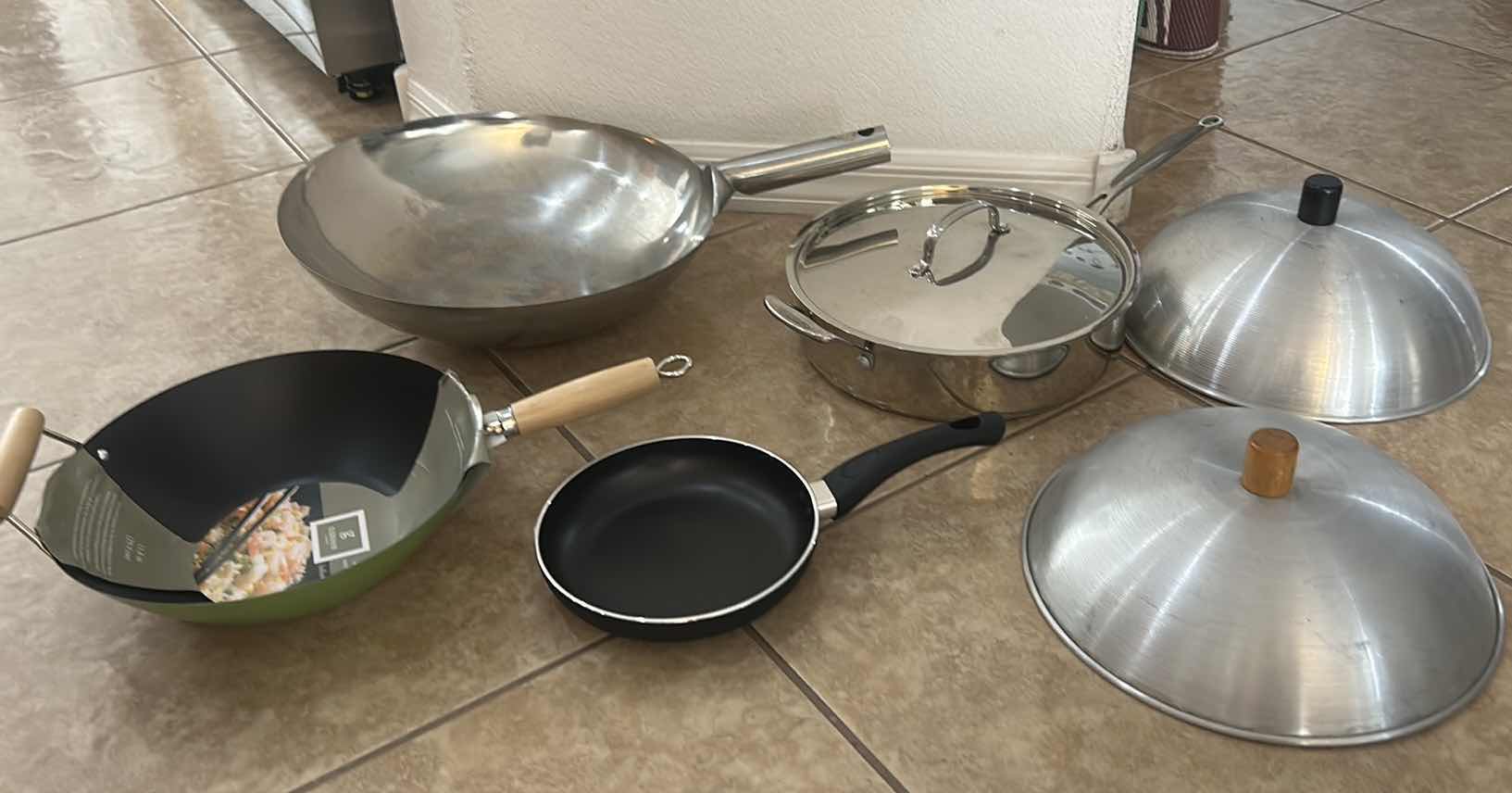 Photo 1 of ASSORTED COOKWARE LOT WITH WOKS, SKILLET, LIDDED PAN & DOME LIDS
MIXED STAINLESS STEEL AND NONSTICK COOKWARE
ESTIMATED RETAIL VALUE: $100–$150