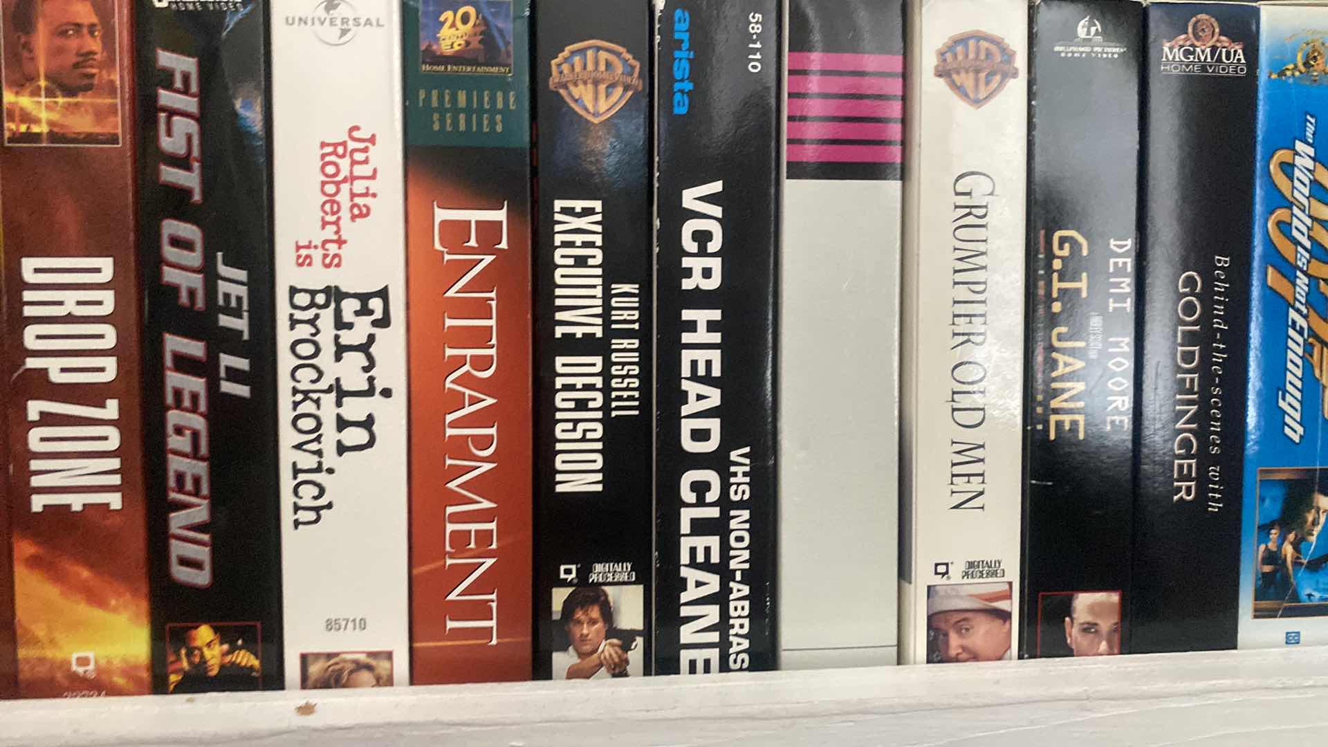 Photo 1 of SHELF OF VHS MOVIES SEE PICTURES