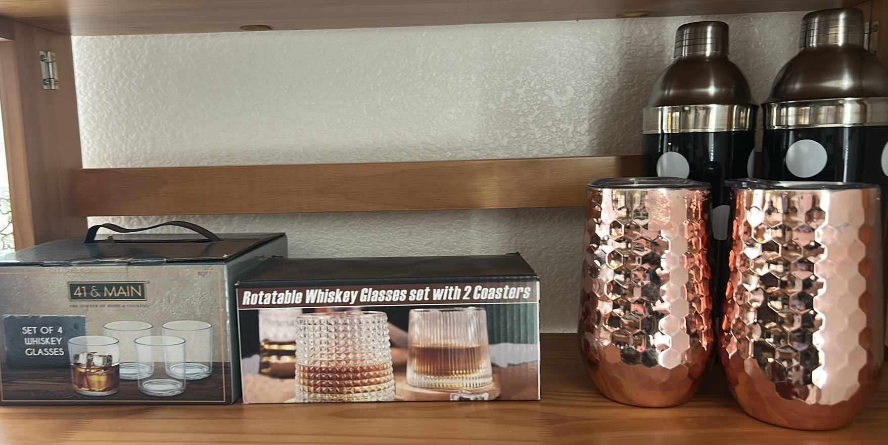 Photo 1 of ASSORTED HOME BARWARE INCLUDING MAINSTAYS WHISKEY GLASS SET, ROTATABLE WHISKEY GLASS SET WITH COASTERS, TWO COCKTAIL SHAKERS & TWO HAMMERED COPPER-TONE TUMBLERS.