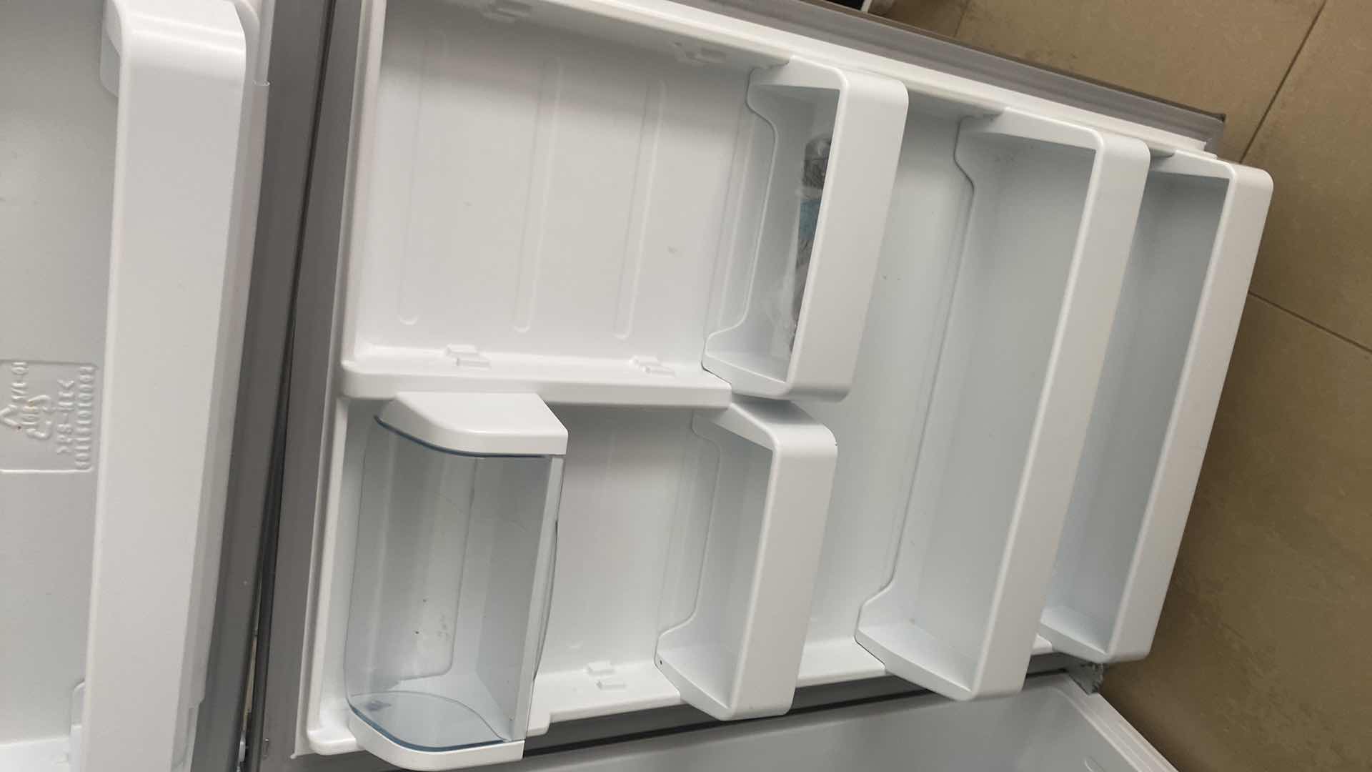 Photo 1 of MIDEA STAINLESS STEEL TOP FREEZER REFRIGERATOR, REVERSIBLE DOORS 29 1/2” X 32” H 66 1/2”