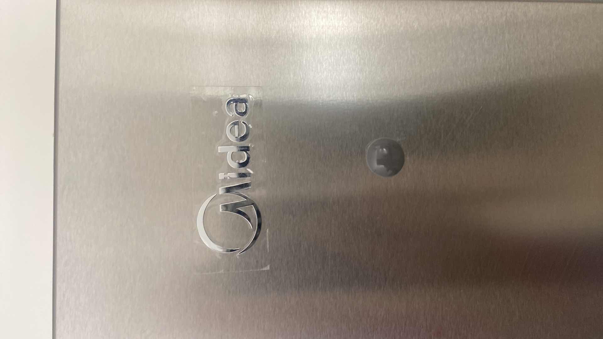 Photo 1 of MIDEA STAINLESS STEEL TOP FREEZER REFRIGERATOR, REVERSIBLE DOORS 29 1/2” X 32” H 66 1/2”