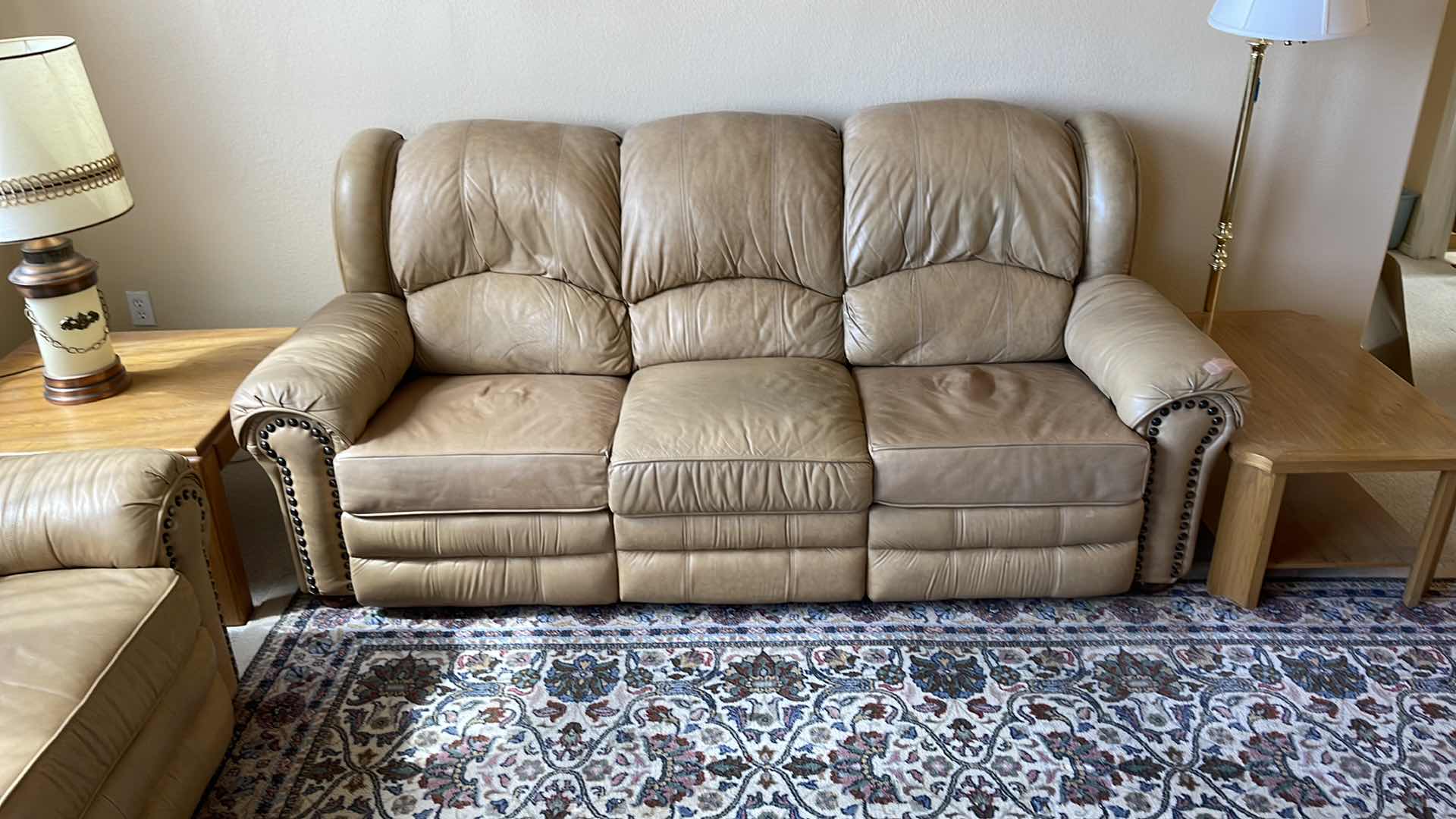 Photo 1 of DOUGLAS 7.5’ LEATHER RECLINING SOFA (MATCHING LOVESEAT SOLD SEPARATELY) HAS TEAR IN ARM