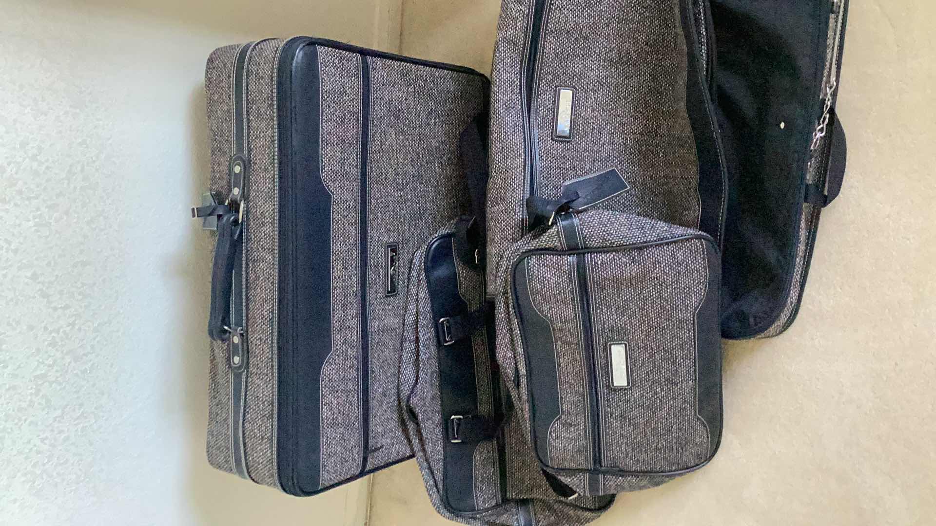 Photo 1 of JORDACH 4 PIECE TRAVEL SET - SUITCASE, GARMENT BAG, WEEKENDER  & SHOULDER BAG