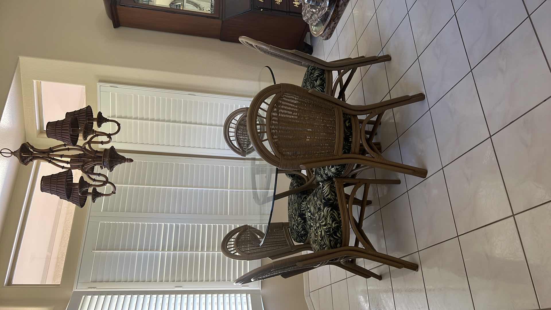 Photo 4 of 48” ROUND GLASSTOP CANE BASE TABLE  W 5 SIDE CHAIRS COVERED IN BLACK & GREEN LEAF UPHOLSTERY (H30")