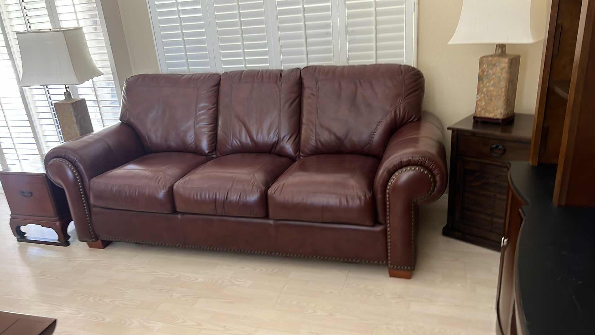 Photo 3 of BURGUNDY LEATHER SOFA W BRASS TACK TRIM 87” x 38”