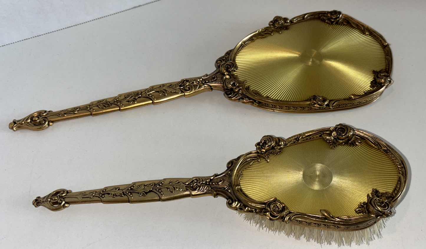 Photo 1 of VINTAGE HANDHELD MIRROR & BRUSH SET, GOLD W FLORAL ACCENTS (MIRROR IS 14”L)