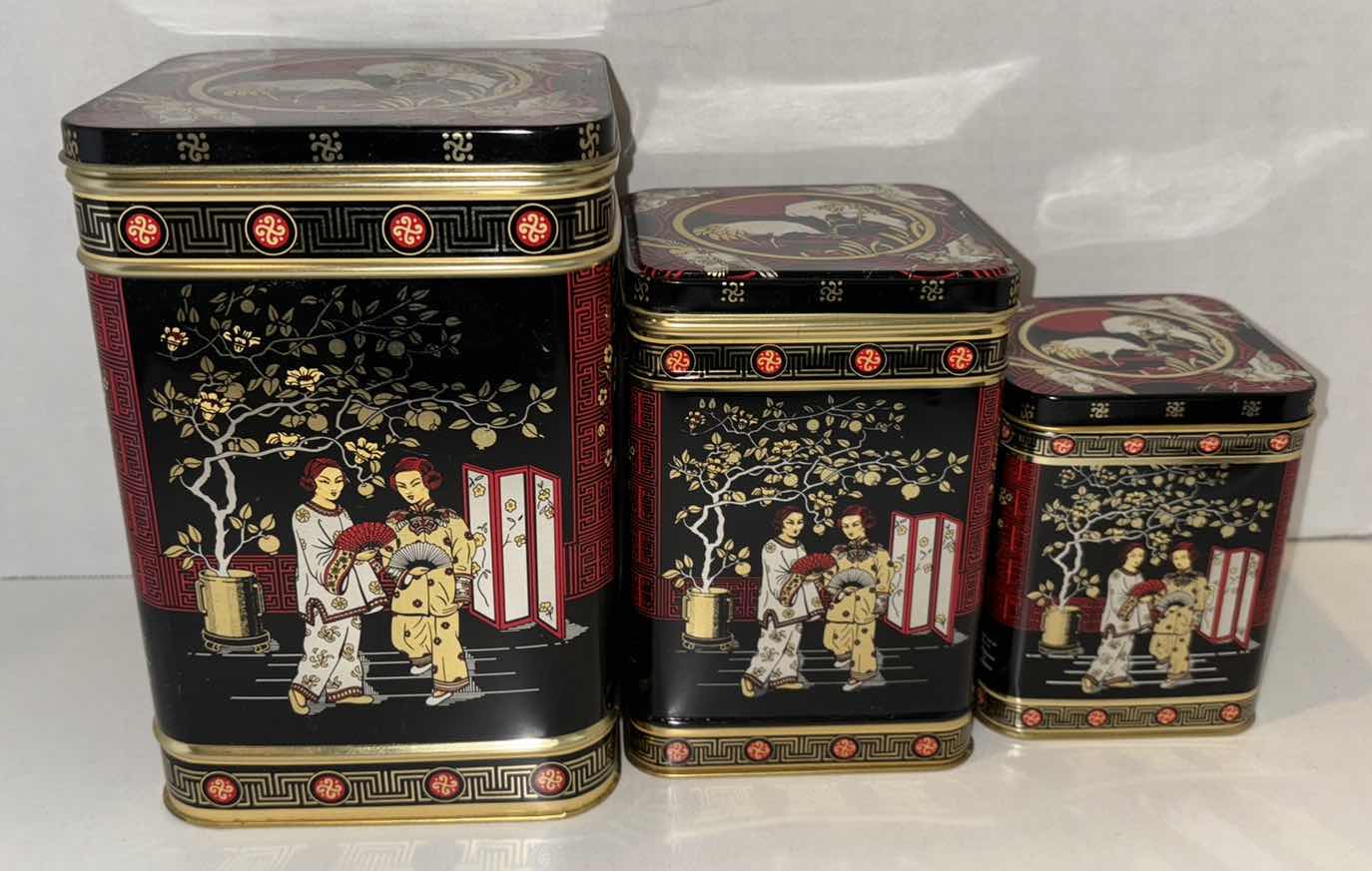 Photo 1 of VINTAGE CHINOISERIE NESTING SQUARE TIN CANISTERS, SET OF 3