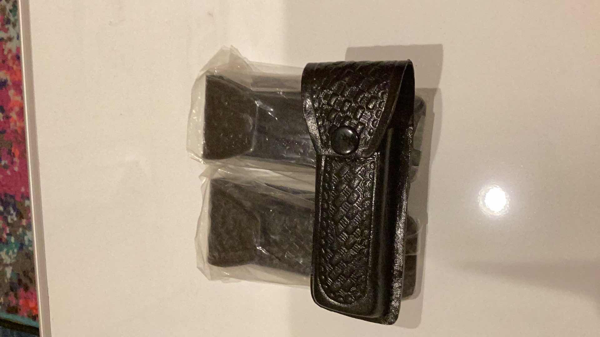 Photo 1 of THREE BLACK LEATHER CLIP HOLDERS