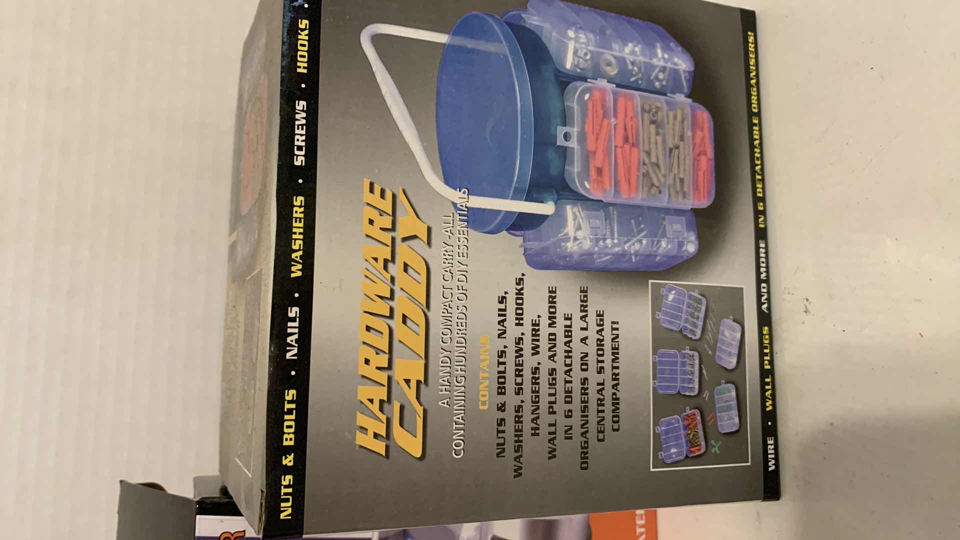 Photo 1 of PHONE AND BATTERY CHARGER, AND A HARDWARE CADDY