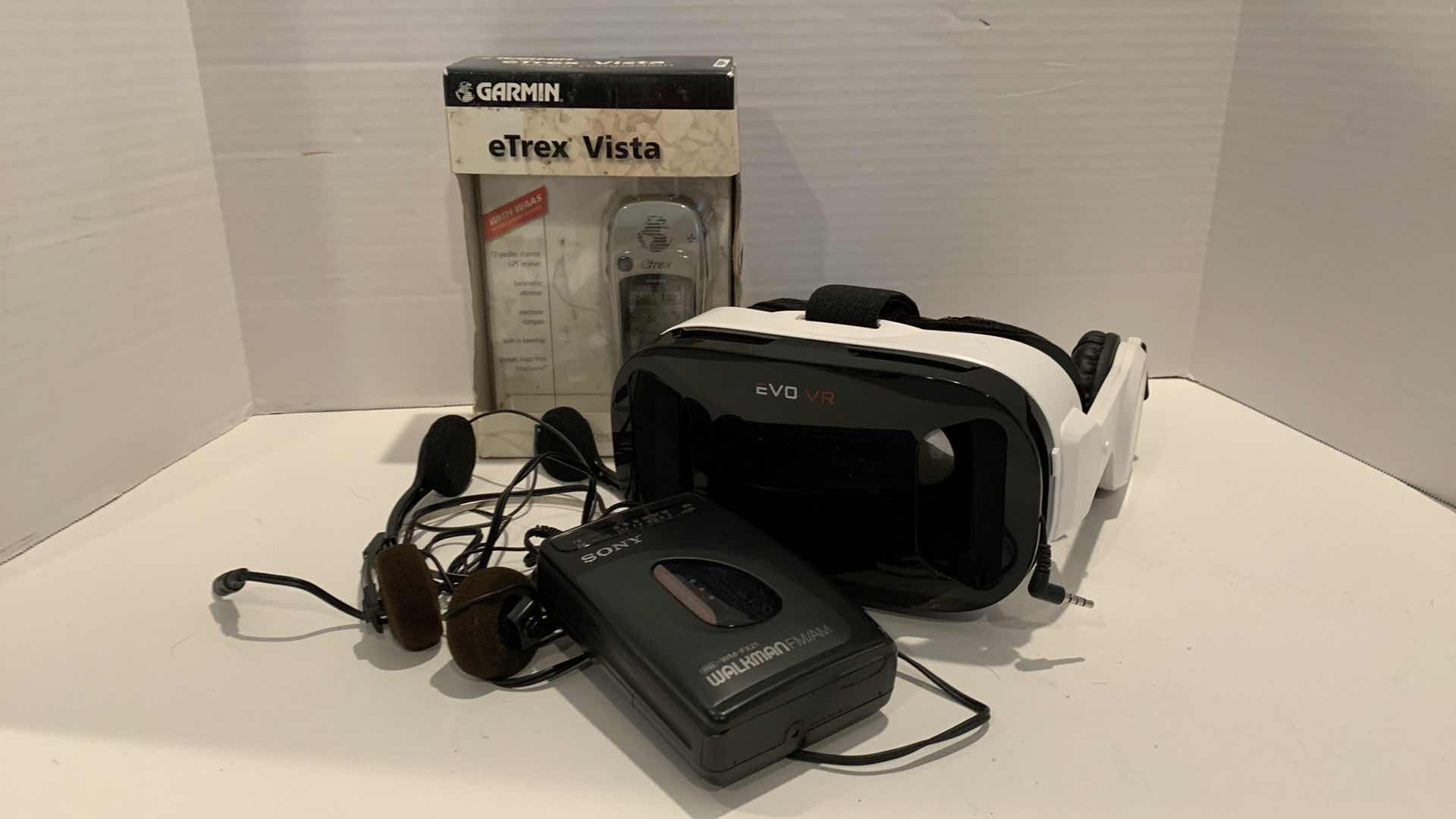 Photo 1 of GARMIN, SONY CASSETTE WALKMAN, AND AN EVO VR HEADSET