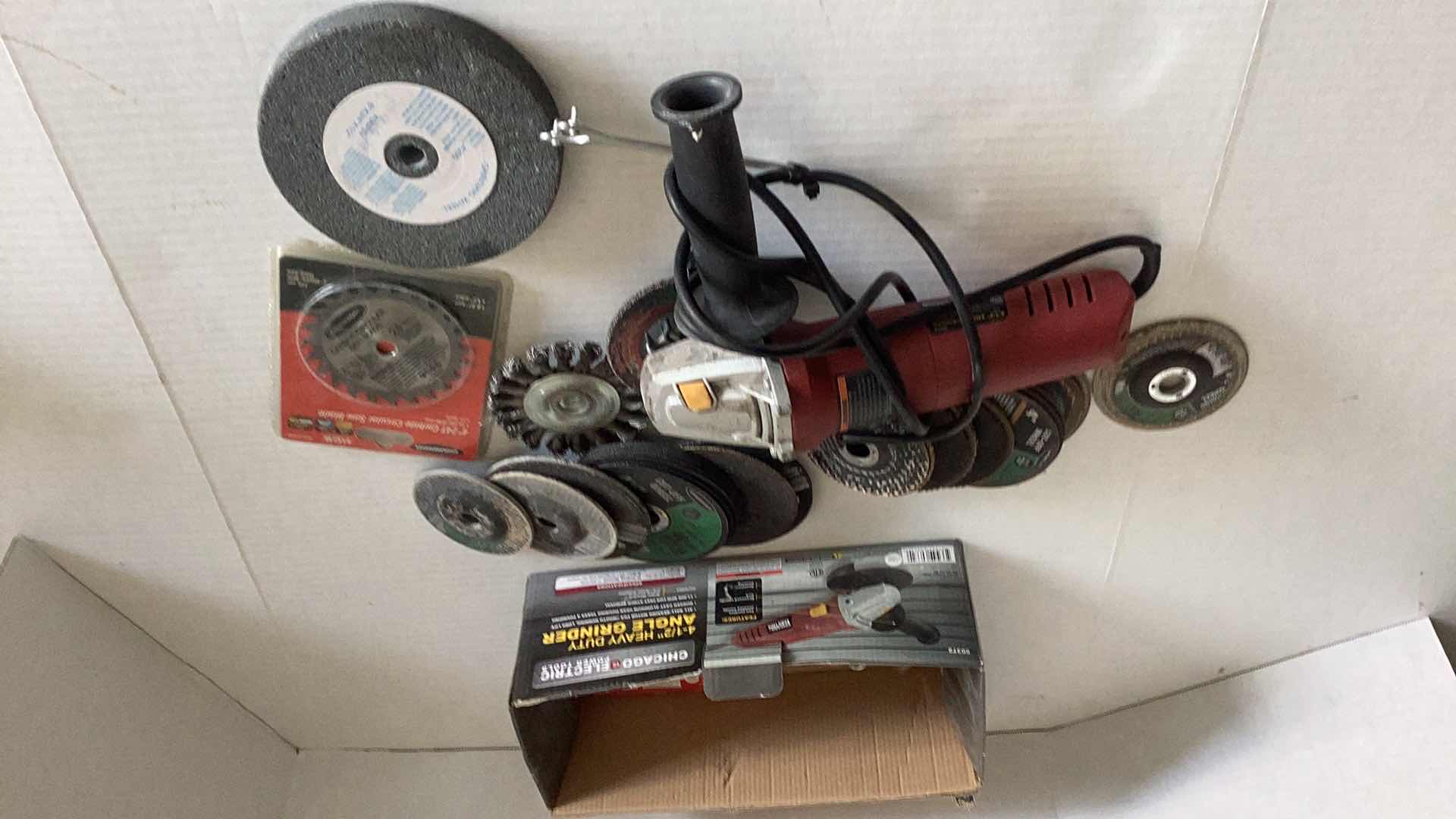 Photo 2 of CHICAGO ELECTRIC 4 1/2” ANGLE GRINDER WITH EXTRA STONES AND SAWBLADE