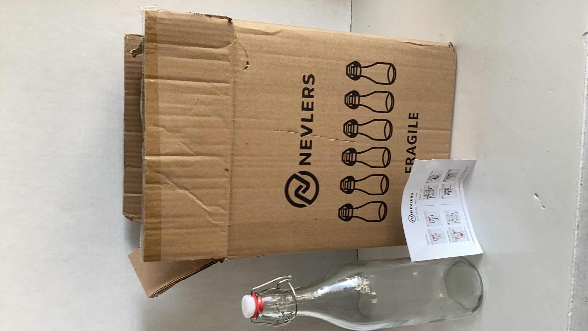 Photo 1 of BOX OF SIX NEVLERS GLASS BOTTLES