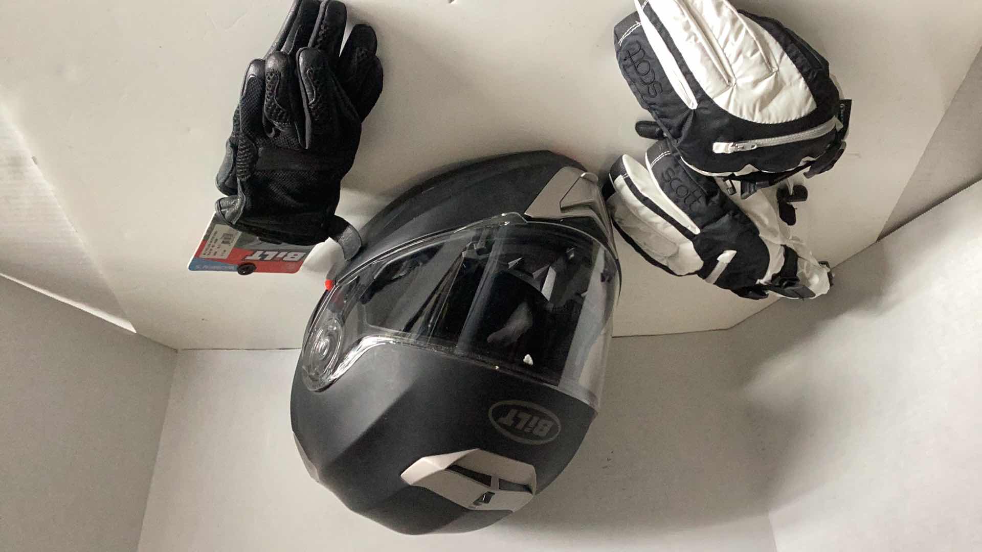 Photo 1 of BILT MOTORCYCLE HELMET SIZE SMALL, GOLVES, AND SCOTT SKI GLOVES