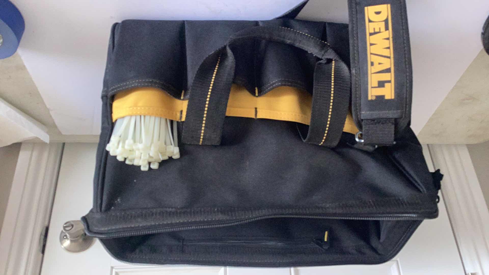 Photo 1 of DEWALT BAG WITH ELECTRIC REPAIR ITEMS