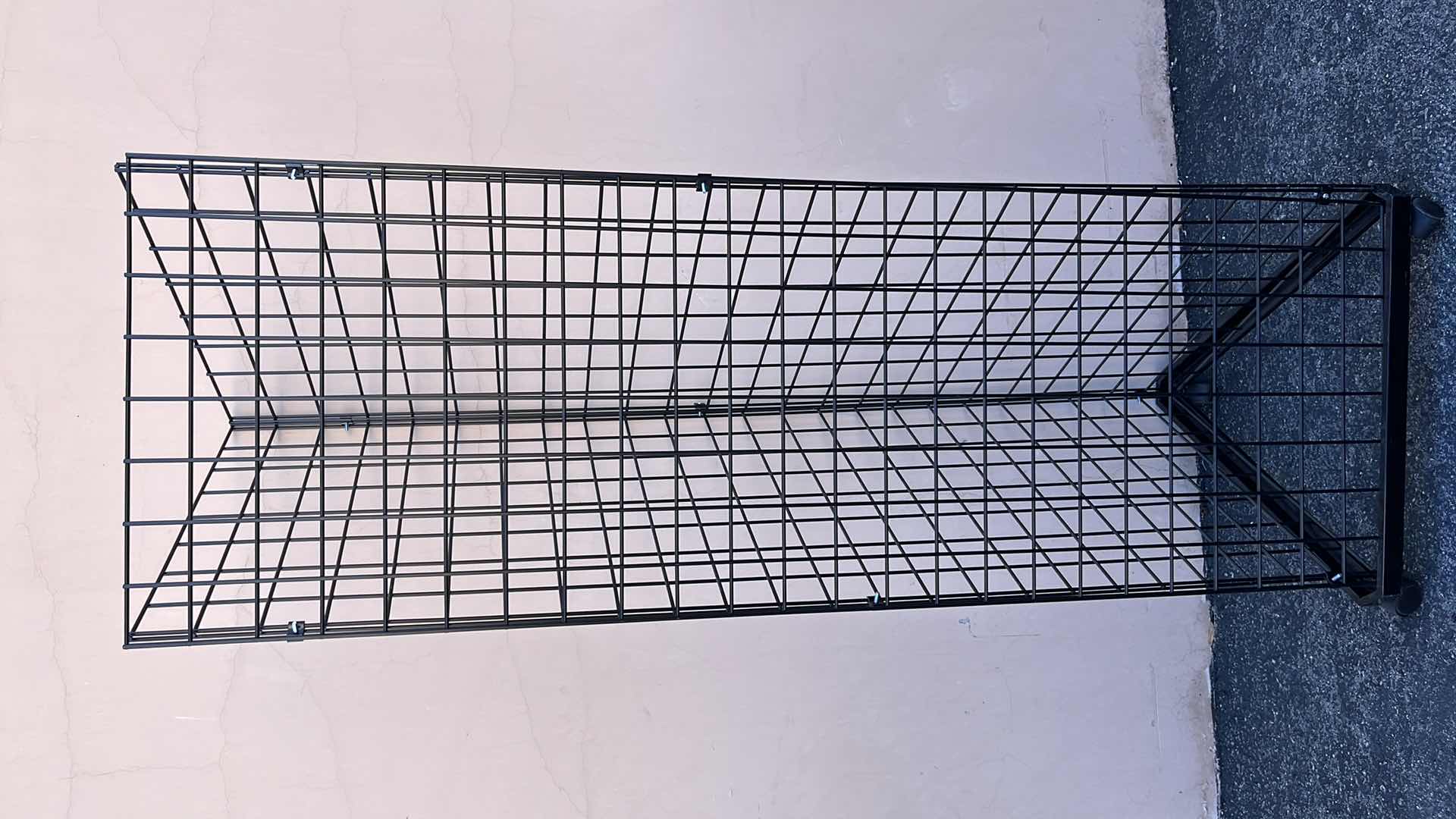 Photo 1 of TRIANGULAR MERCHANDISE RACKS W WHEELS 24” X 24” H75” (1)