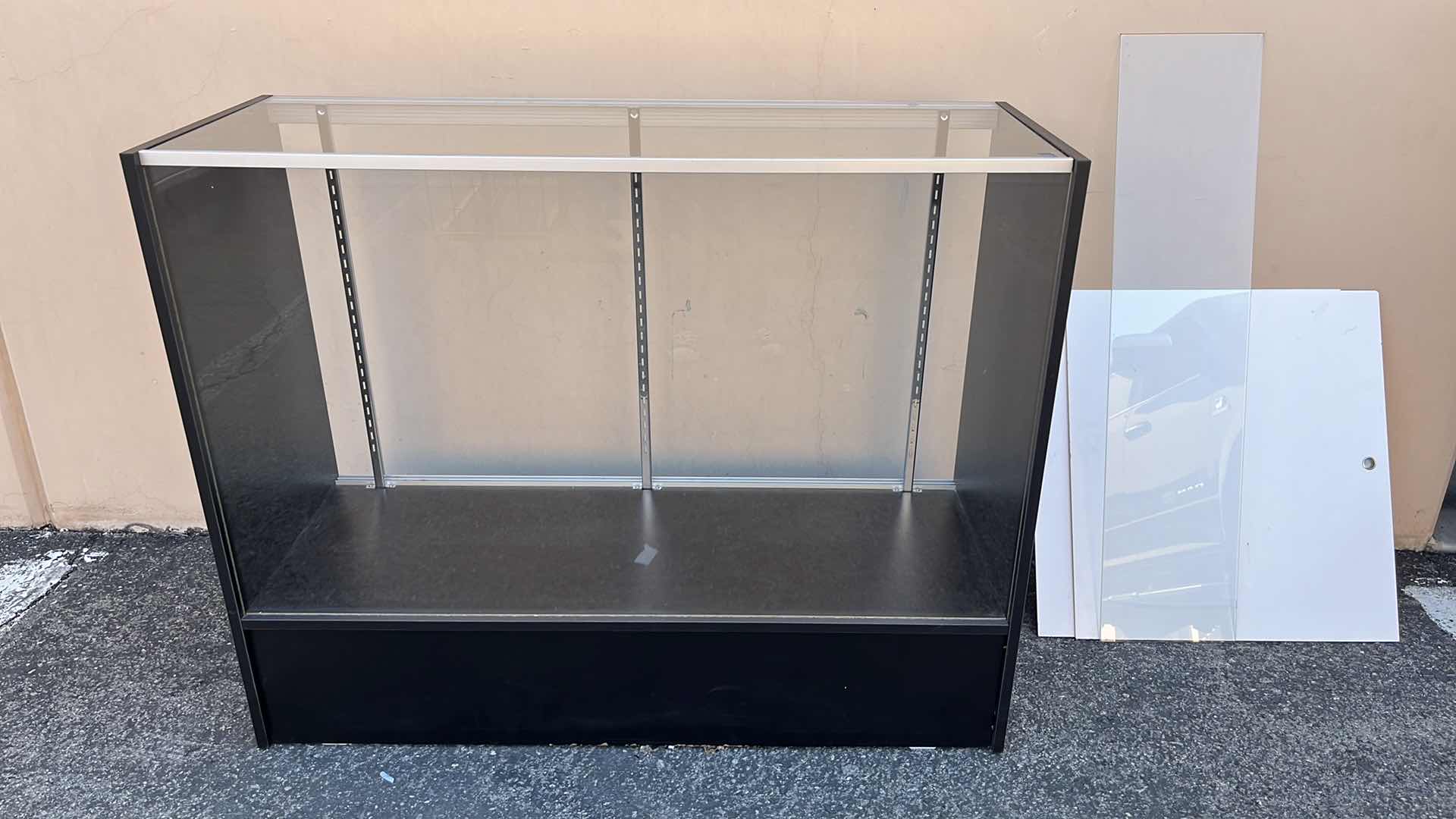 Photo 1 of GLASS MERCHANDISE DISPLAY CASE W 1 GLASS SHELF & 2 DOORS 18” X 48” H38.25”