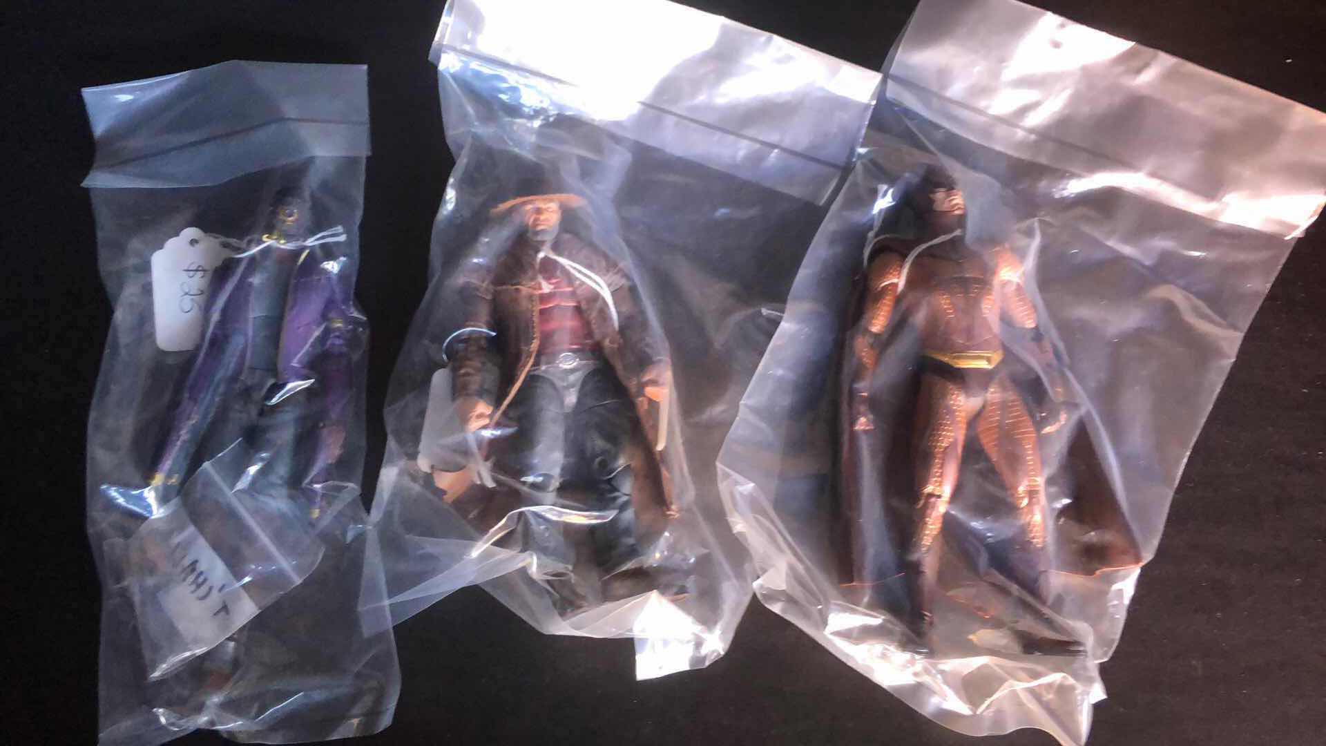 Photo 1 of ASSORTMENT OF UNBOXED ACTION FIGURES (3)