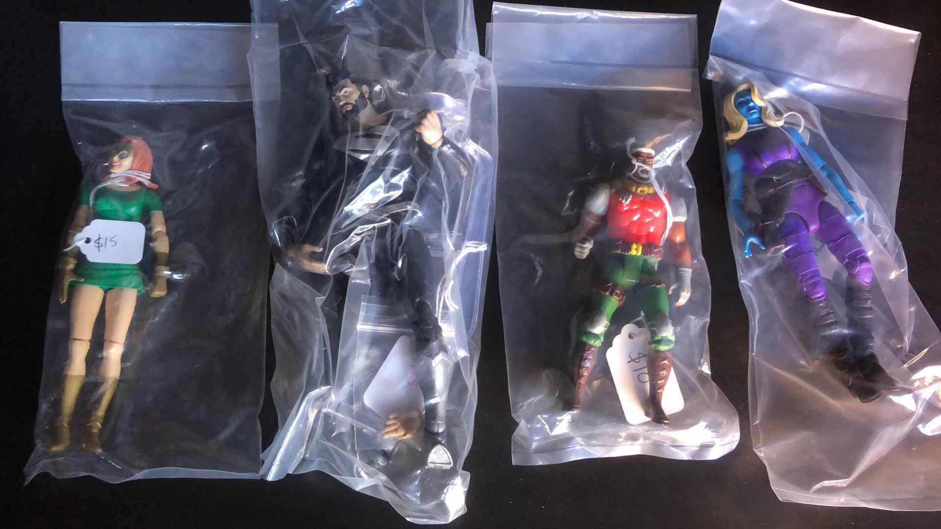 Photo 1 of ASSORTMENT OF UNBOXED ACTION FIGURES (4)