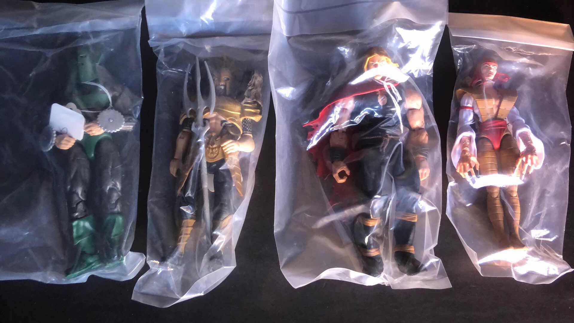 Photo 1 of ASSORTMENT OF UNBOXED ACTION FIGURES (4)