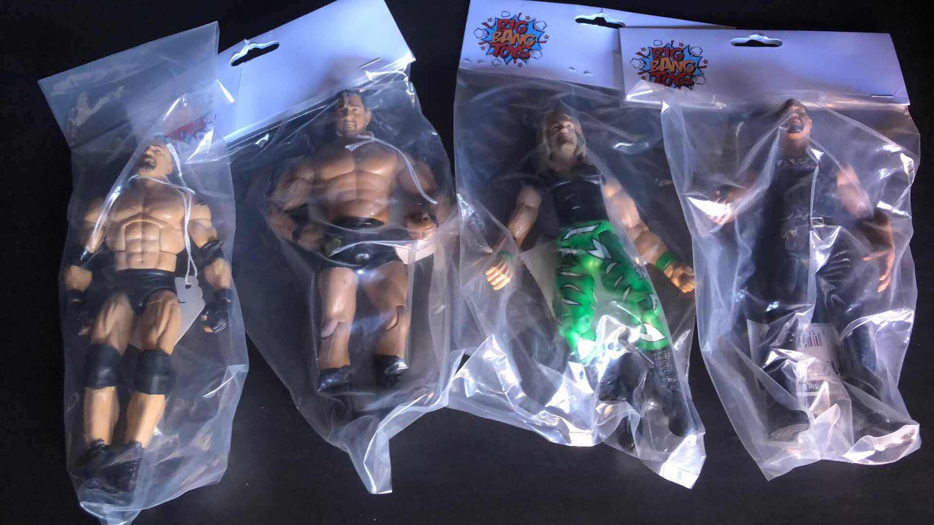 Photo 1 of ASSORTMENT OF UNBOXED WRESTLING ACTION FIGURES (4)