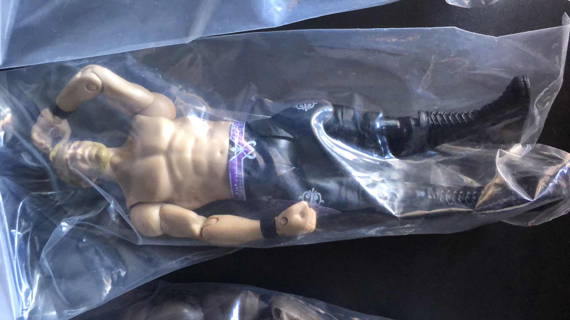 Photo 3 of ASSORTMENT OF UNBOXED WRESTLING ACTION FIGURES (4)