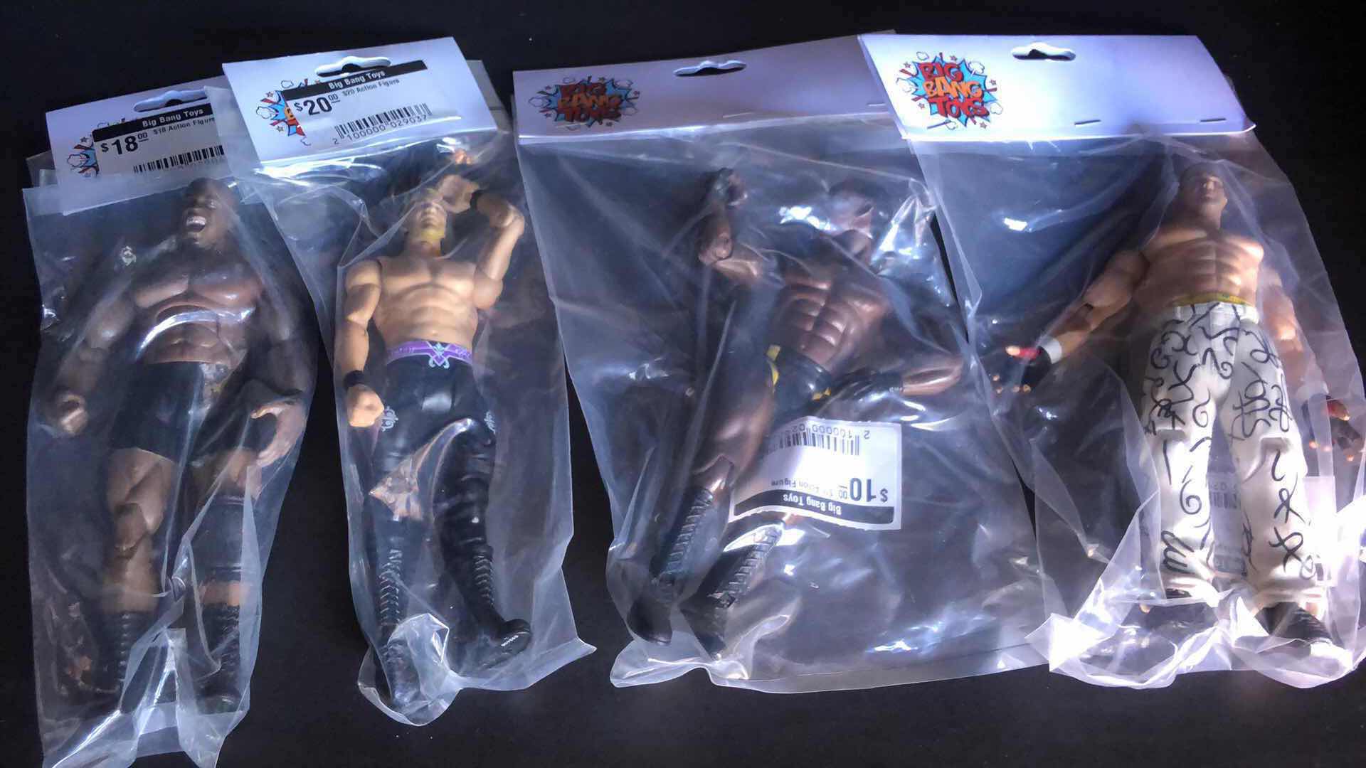 Photo 1 of ASSORTMENT OF UNBOXED WRESTLING ACTION FIGURES (4)