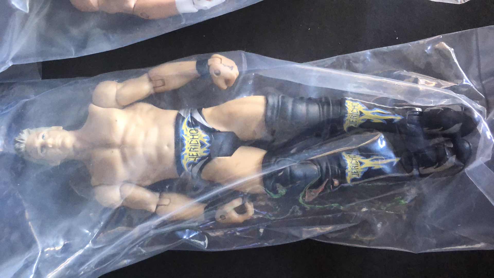 Photo 2 of ASSORTMENT OF UNBOXED WRESTLING ACTION FIGURES (4)